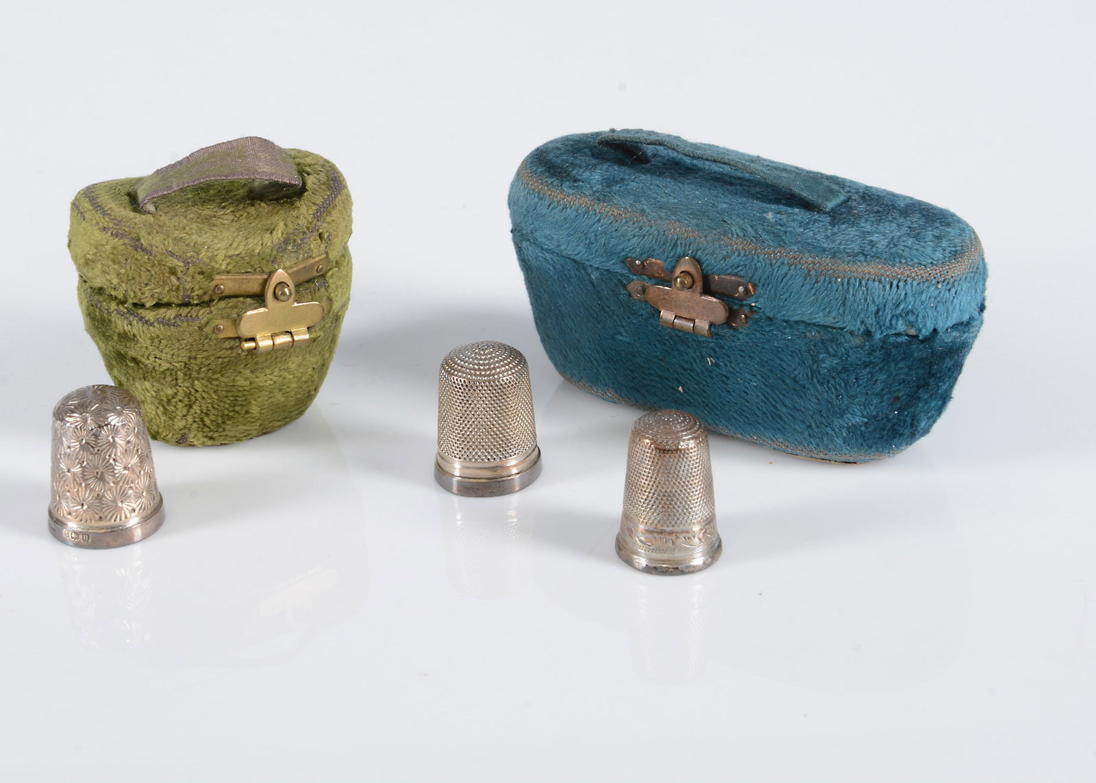 A late 19th century miniature green velvet hat box thimble case, (1 of 2)