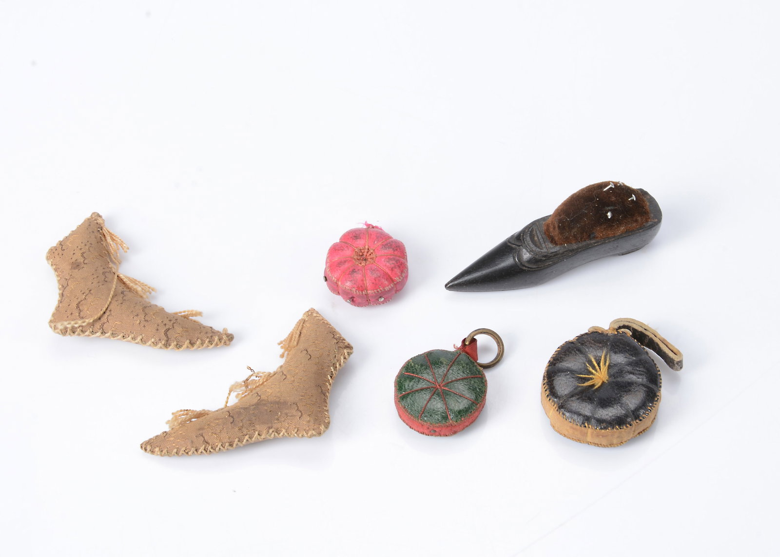 Three 19th century leather pincushions, (1 of 1)