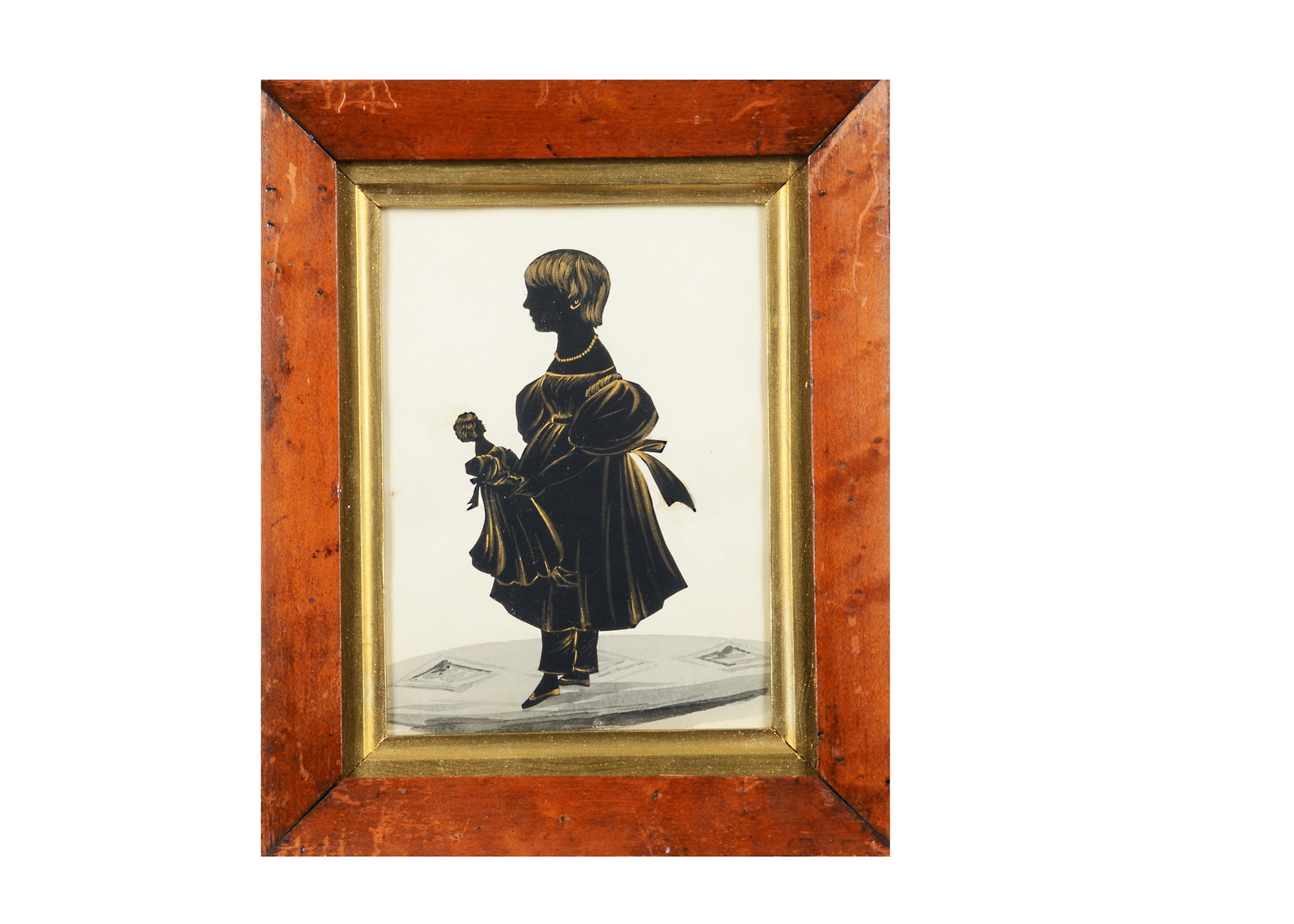 A mid 19th century silhouette of a girl with her doll,: A mid 19th century silhouette of a girl with her doll, highlighted in gold, in original maple frame —9in. (23cm.) x 7 1/4in. (18.5cm.)