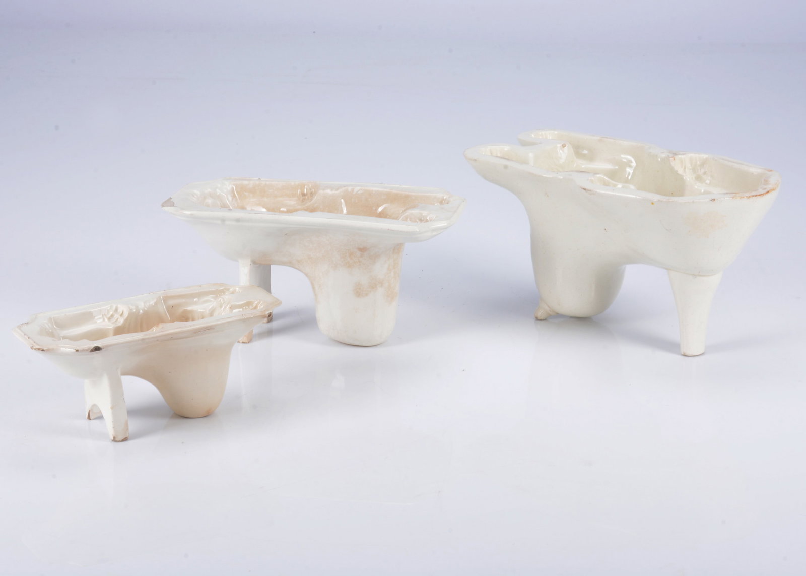Three graduated English creamware lion aspic moulds, 1830s, (1 of 2)