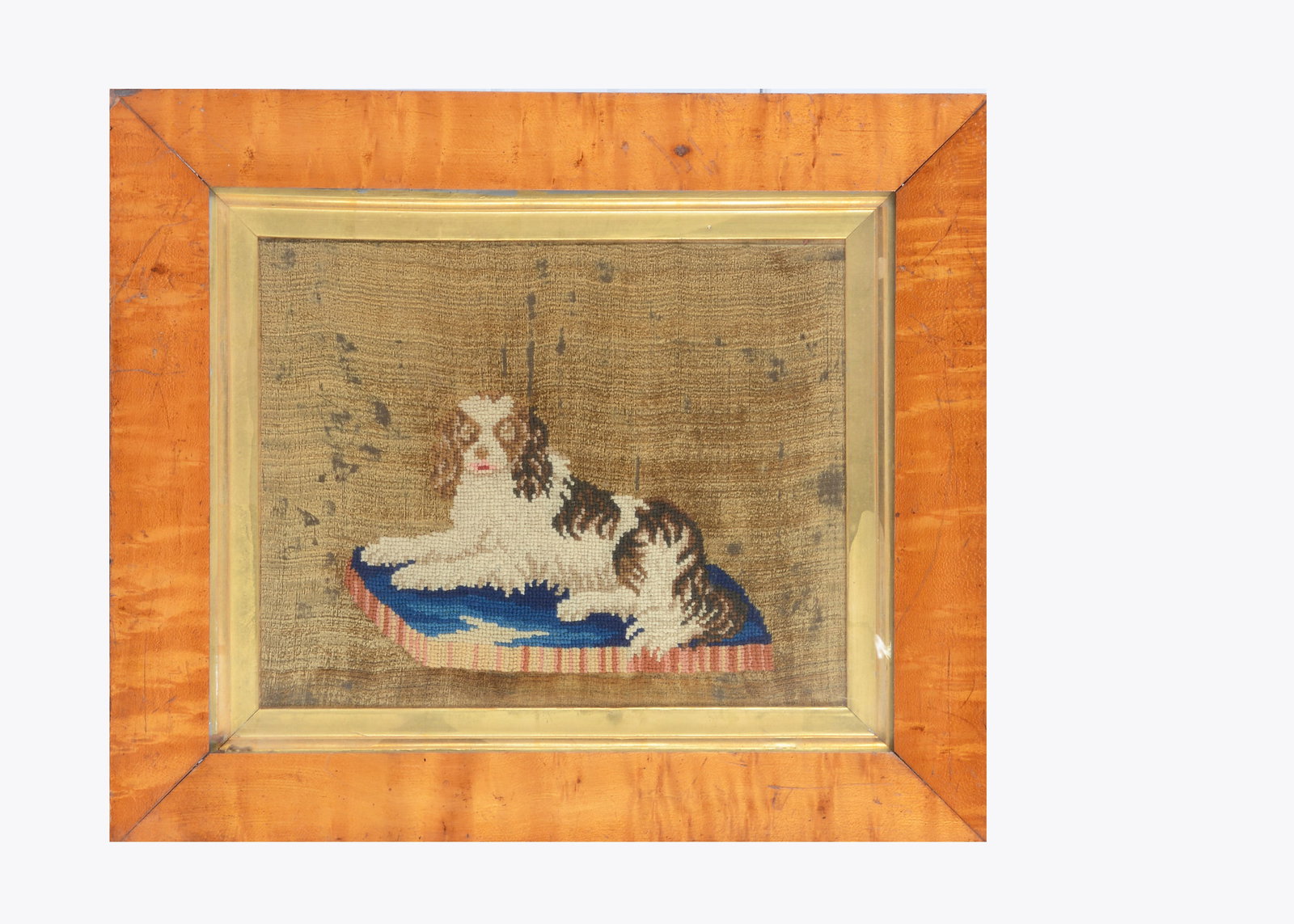 An 19th century wool work of a King Charles spaniel on a cushion, (1 of 1)
