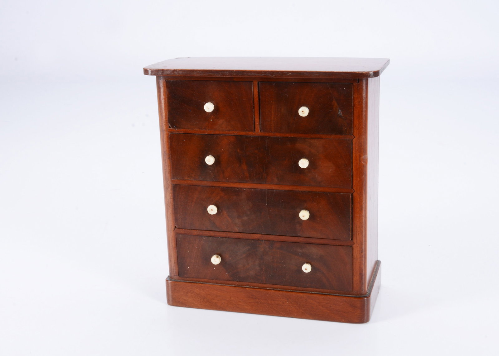 An 19th century dolls’ mahogany chest of drawers, (1 of 2)