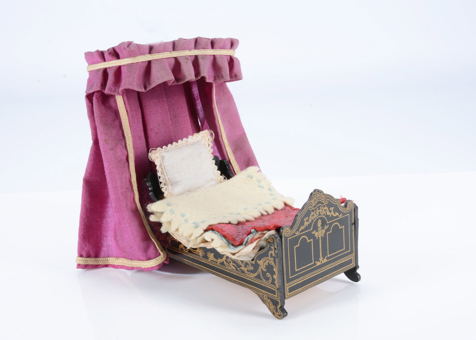 An 19th century Waltershausen dolls’ house bed, (1 of 2)