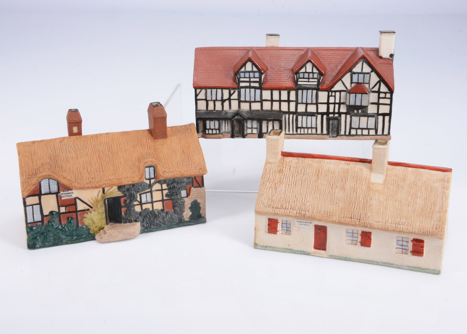 Three larger size Goss bisque cottages,: Three larger size Goss bisque cottages, Robert Burn’s cottage —6in. (15cm.) long, Shakespeare’s House and Ann Hathaway’s Cottage