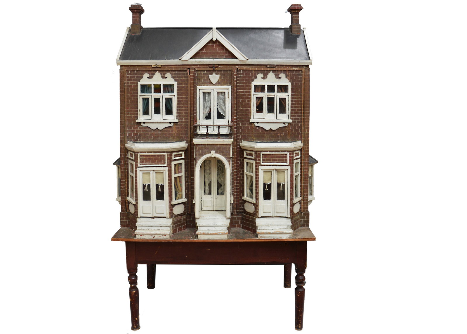 A large Edwardian English wooden dolls’ house on stand, (1 of 3)