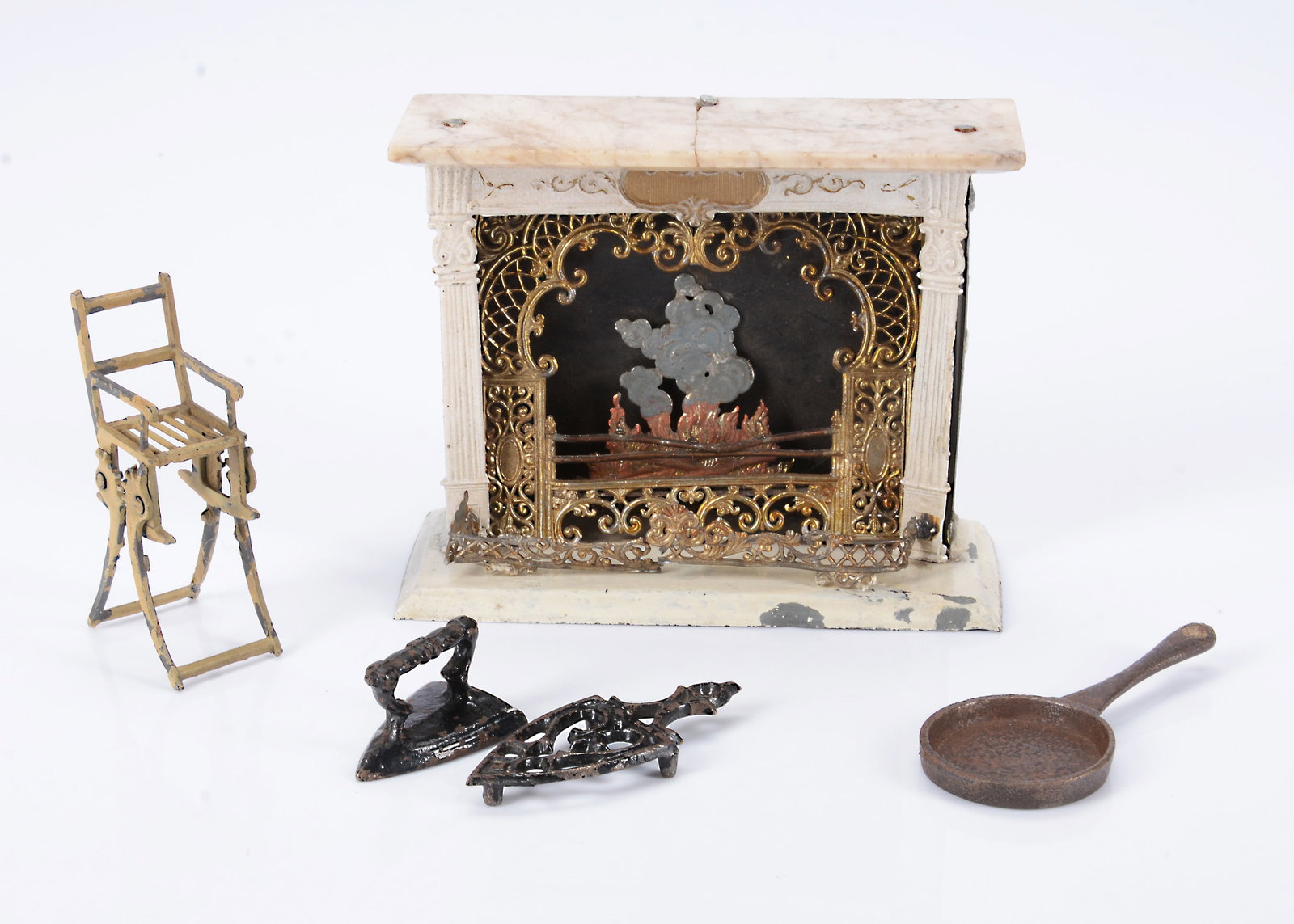 An 19th century German soft metal and tinplate dolls’ house fireplace, (1 of 1)