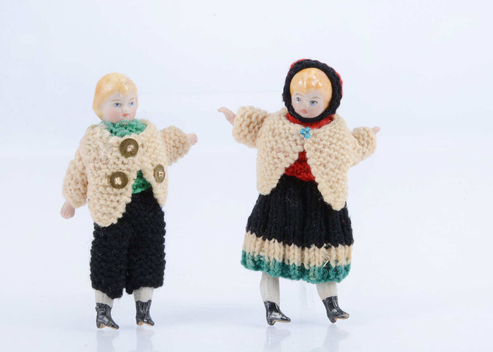 A pair of Simon & Halbig bisque children shoulder-head dolls’ house dolls in original knitted (1 of 2)