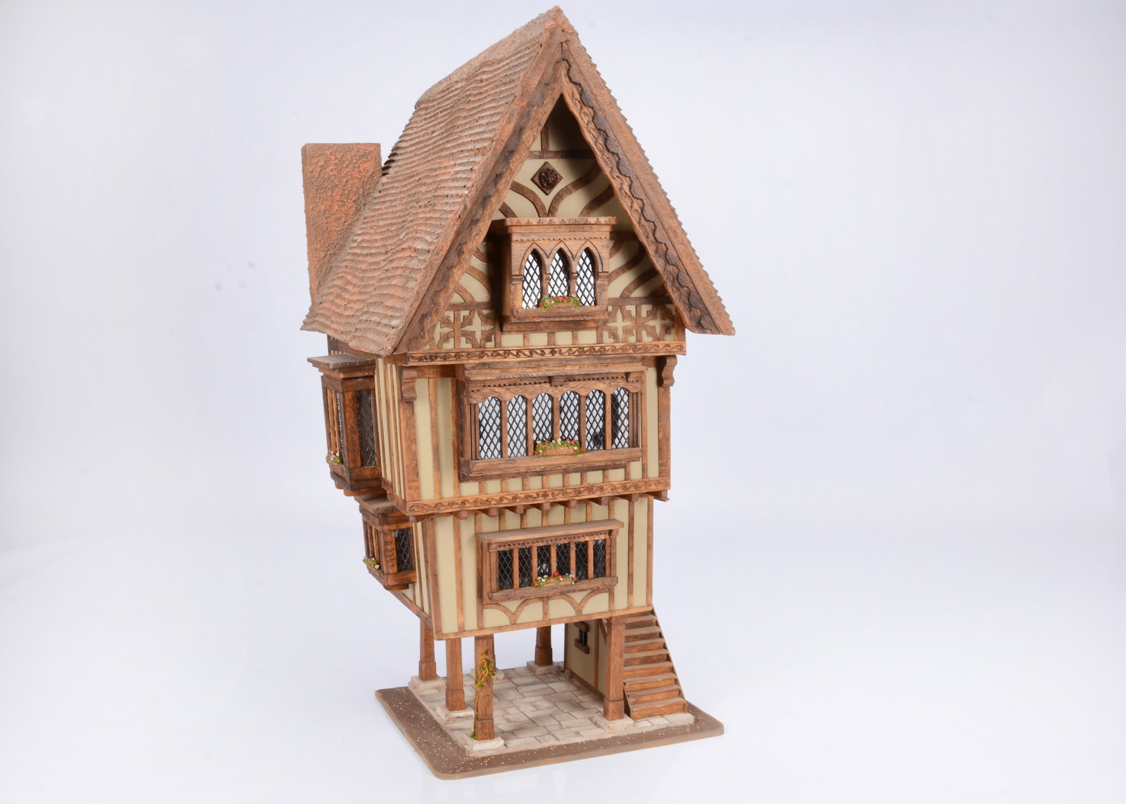 A Jim Hensley Trigger Pond 1/24th scale Tudor style timbered dolls’ house, (1 of 2)