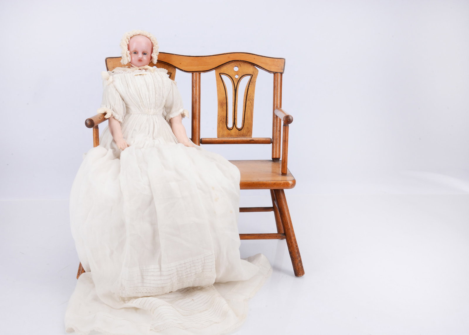 An 19th century F. Aldis (England) poured wax doll dressed as a baby, (1 of 2)