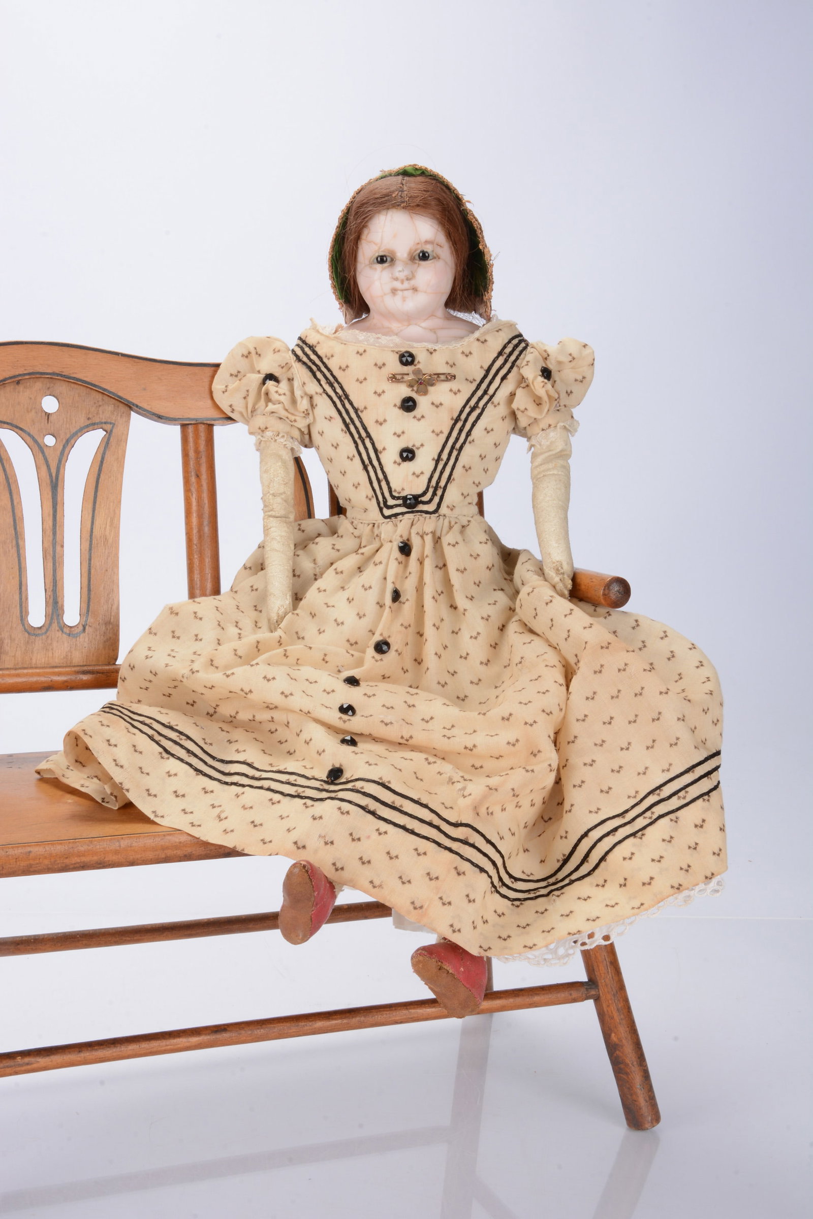 An 1840s English wax over papier-mâché child doll, (1 of 2)