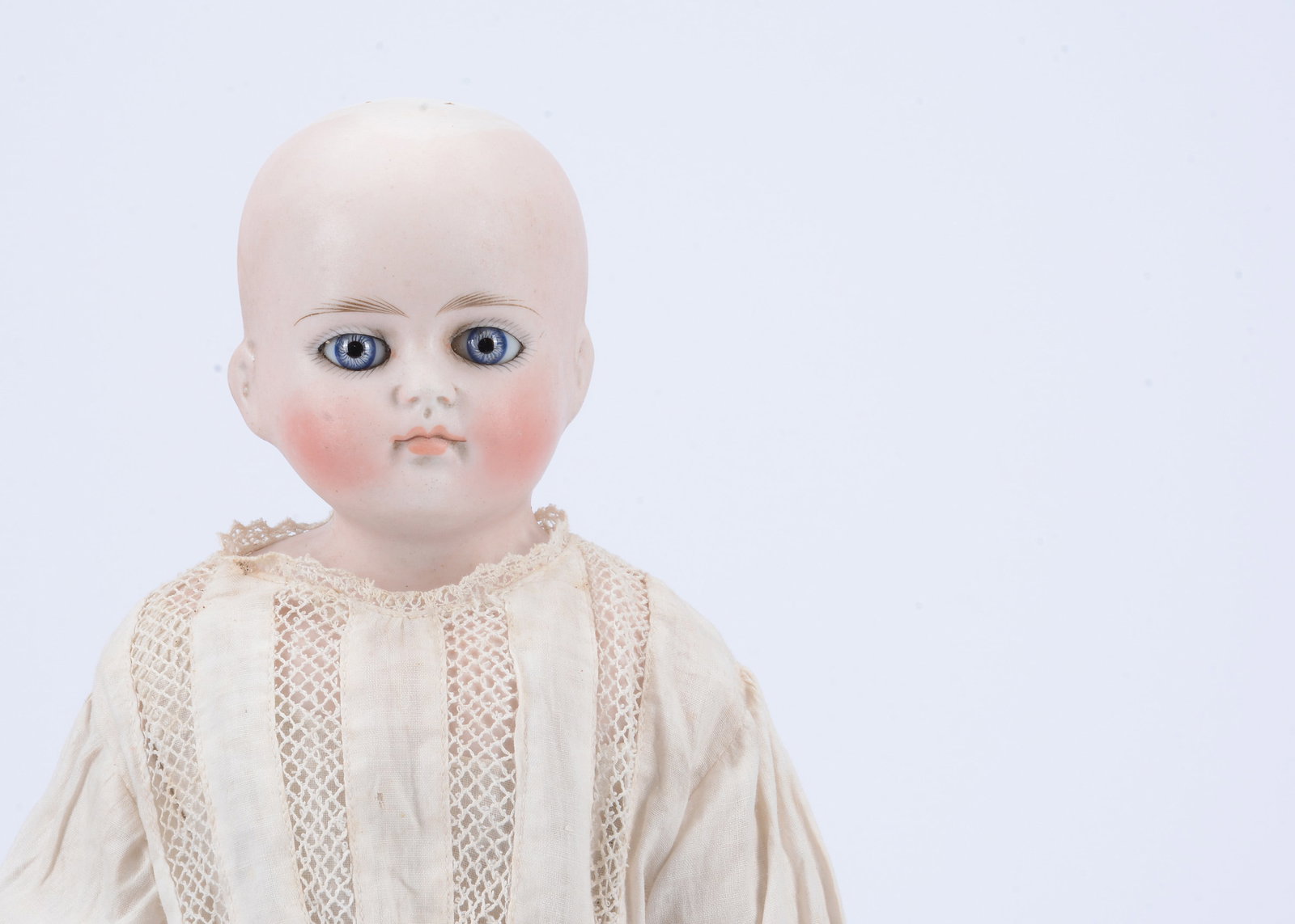 A Kling solid dome turned shoulder head doll, (1 of 2)