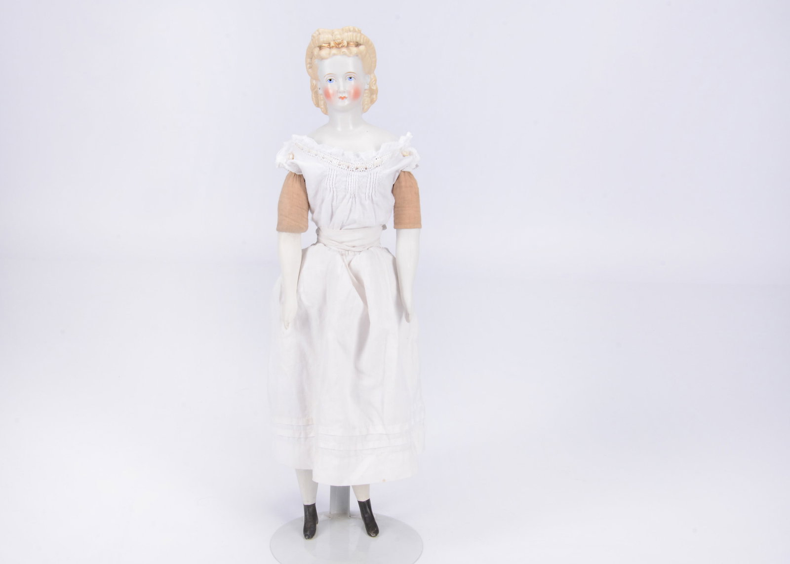 An 19th century German bisque shoulder head doll with elaborate hair, (1 of 2)
