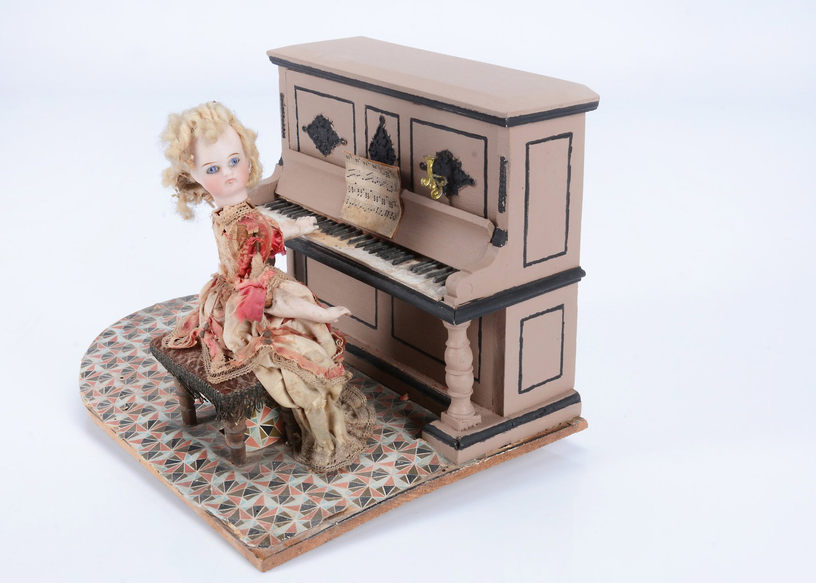 An 19th century automaton of a girl at a piano, (1 of 2)