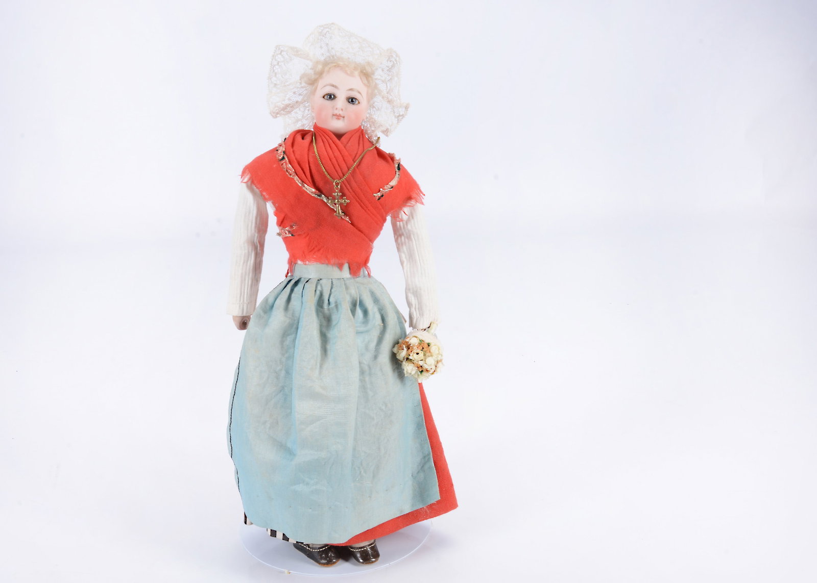 A Francois Gaultier fisherwoman fashion doll,: A Francois Gaultier fisherwoman fashion doll, With fixed blue glass eyes, close mouth, pierced ears, blonde mohair curls at forehead, fixed neck on shoulders, stuffed straight limbed body, terracotta 