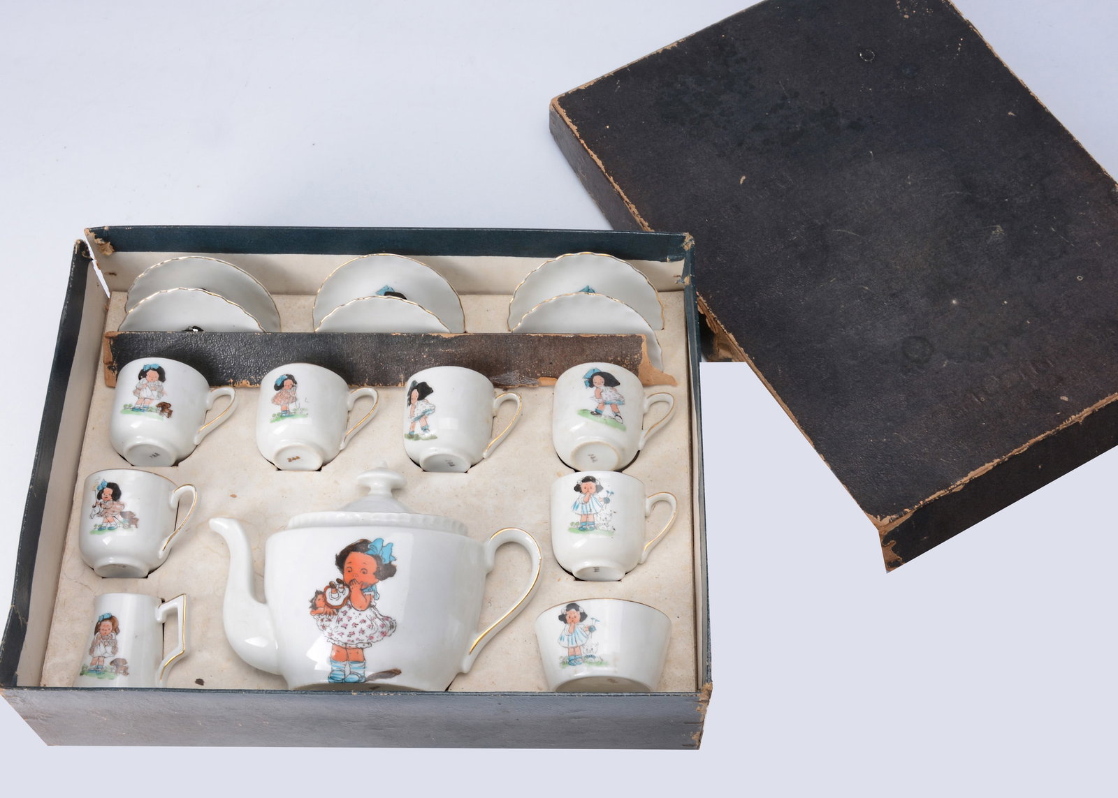 A continental doll's tea set, with comic girl 1910-20s, (1 of 1)