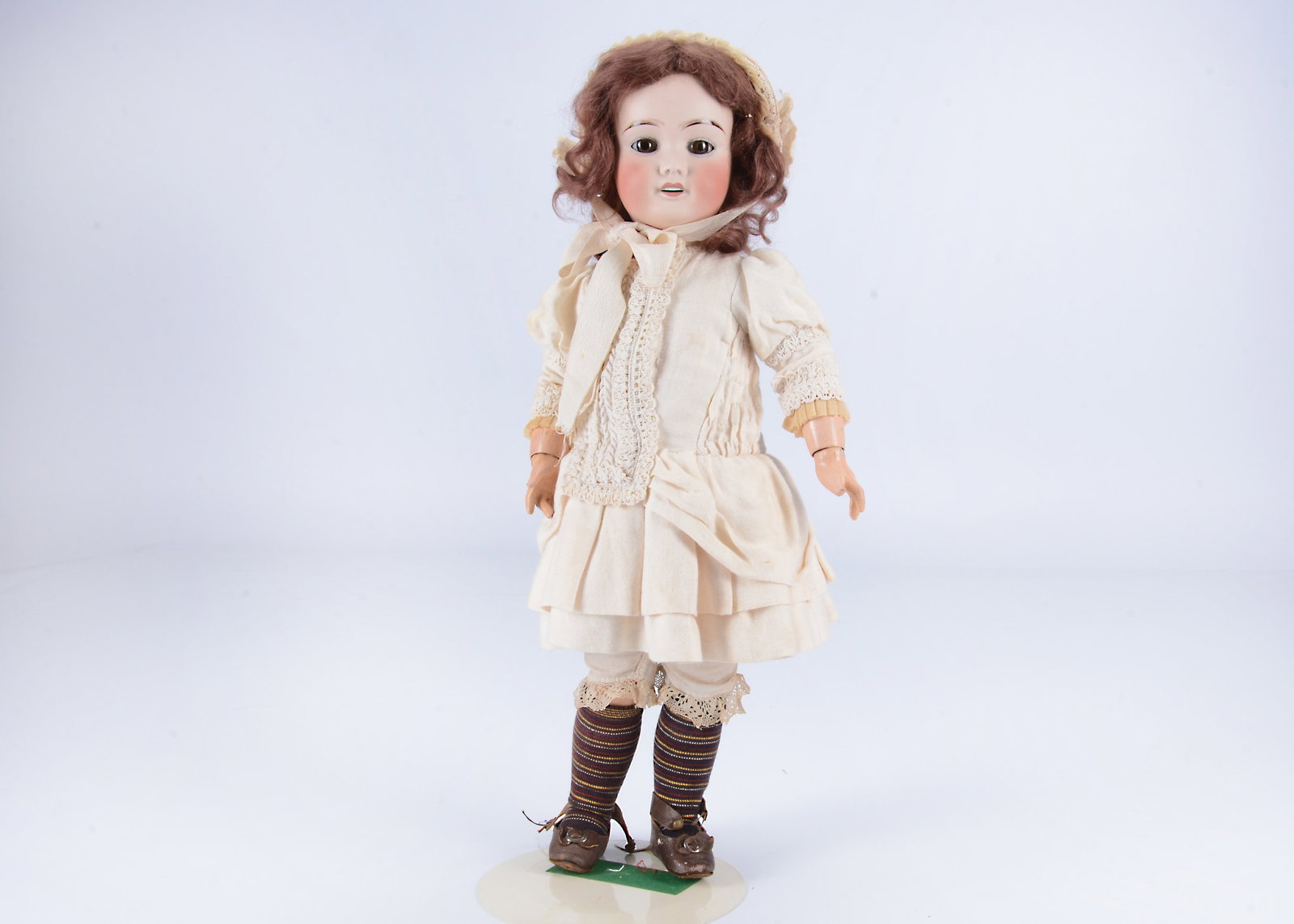 A French Limoges bisque headed child doll, (1 of 2)