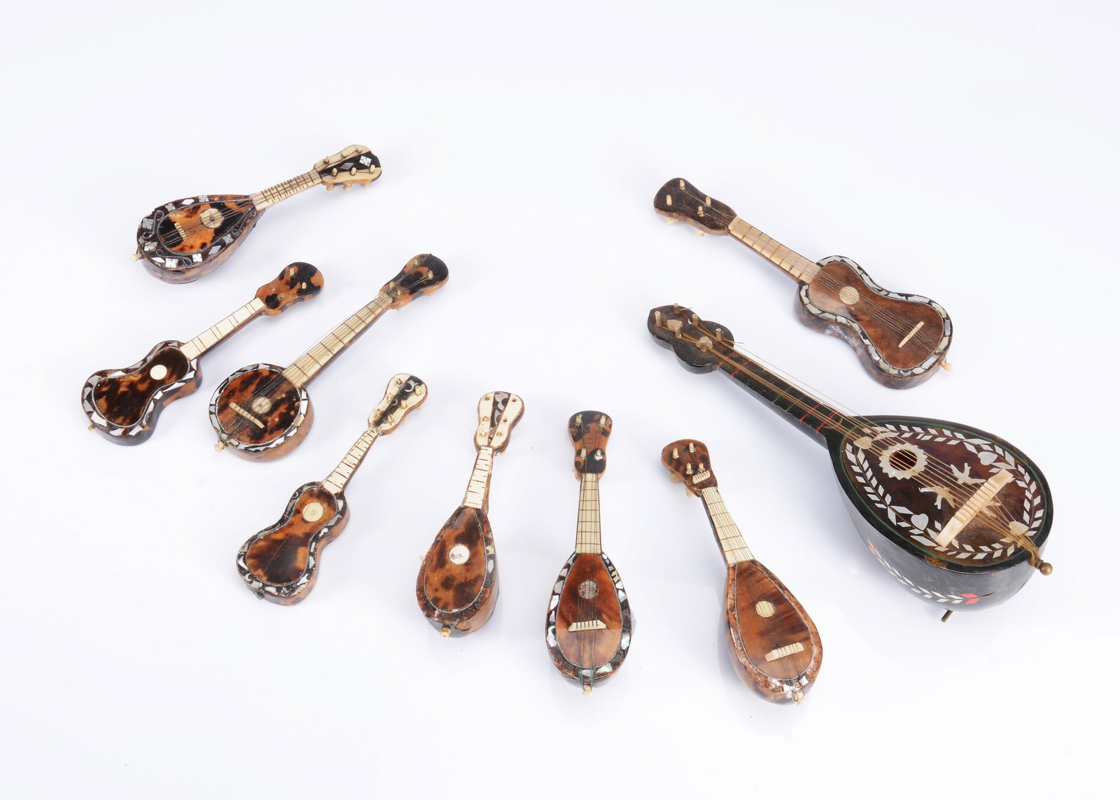 Nine miniature string instruments for doll's (1 of 2)