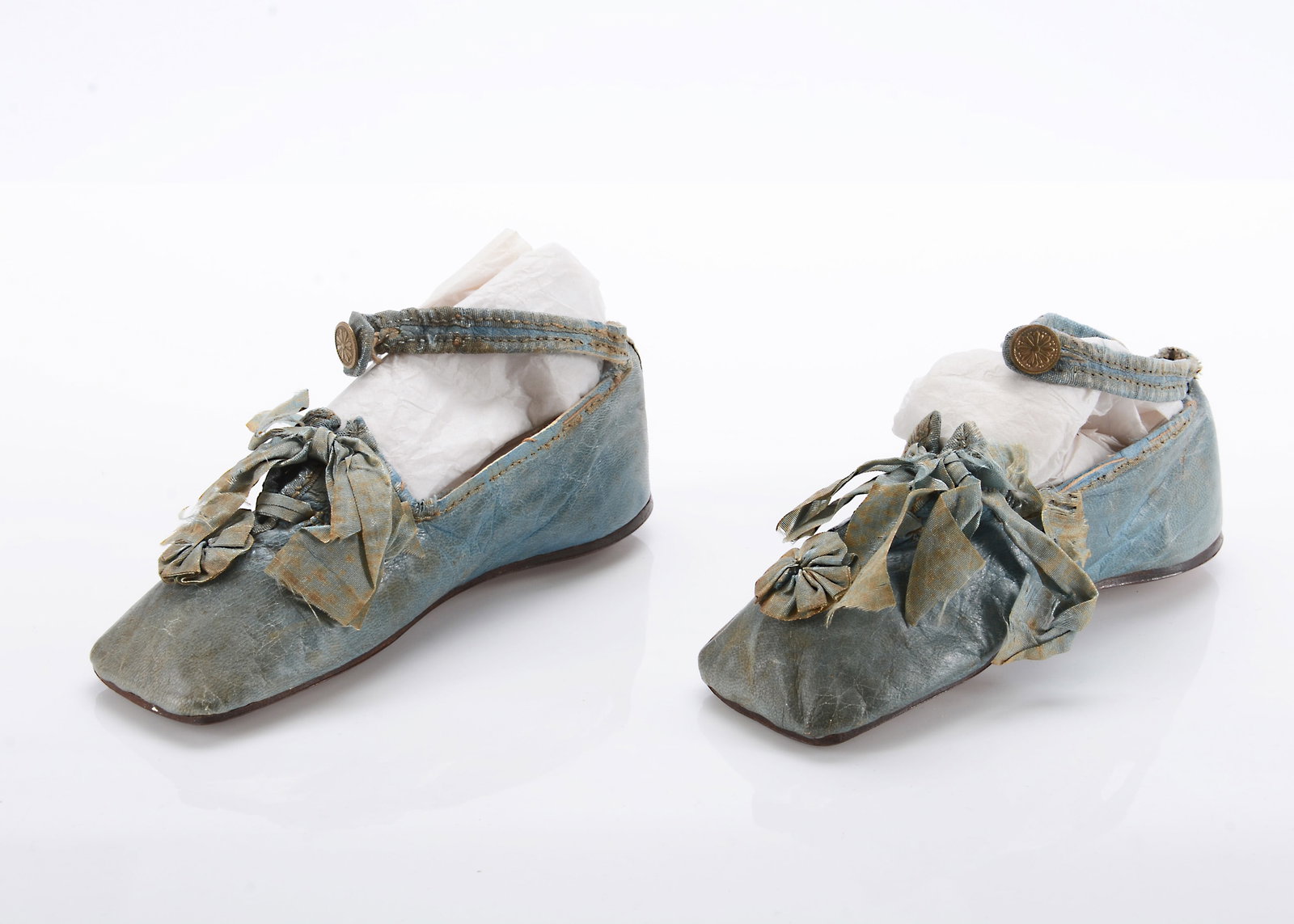 An early 19th century pair of child's blue slippers, (1 of 3)