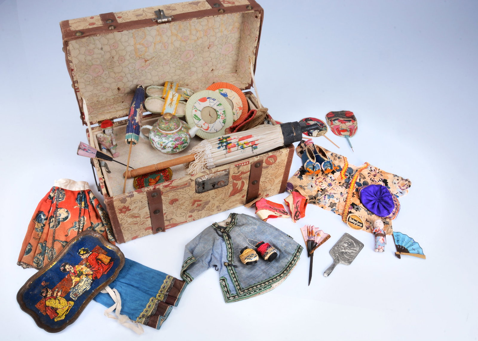 A doll's trunk with fabric covering of Asian printed fabric with Chinese and Japanese doll (1 of 3)