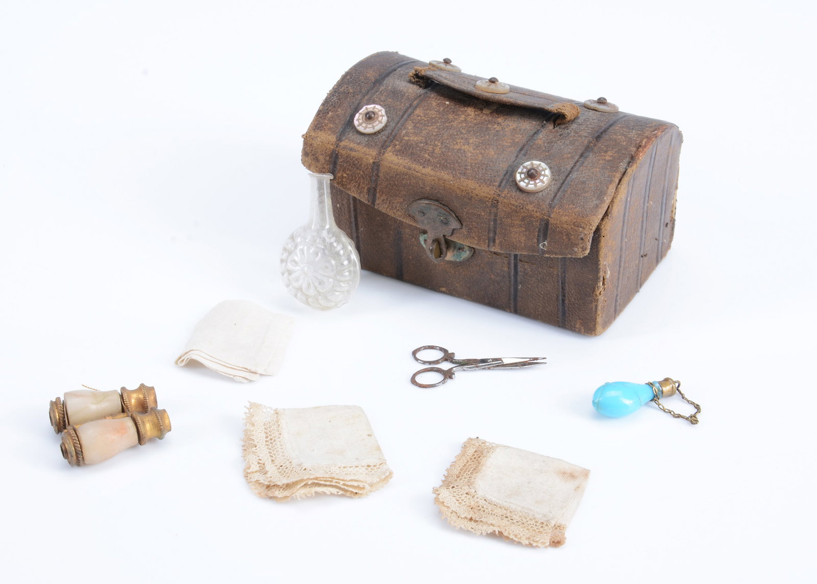 A miniature leather doll's trunk, (1 of 2)