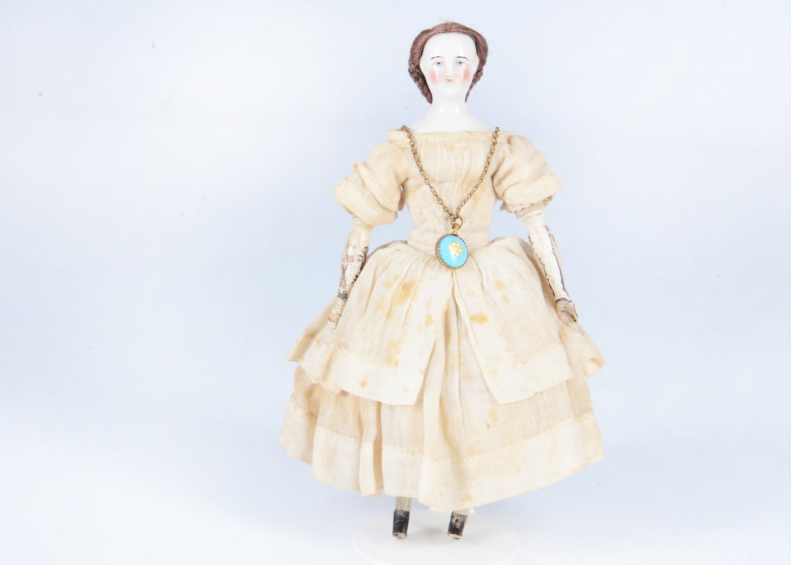 An 19th century German wigged china shoulder head doll, (1 of 3)