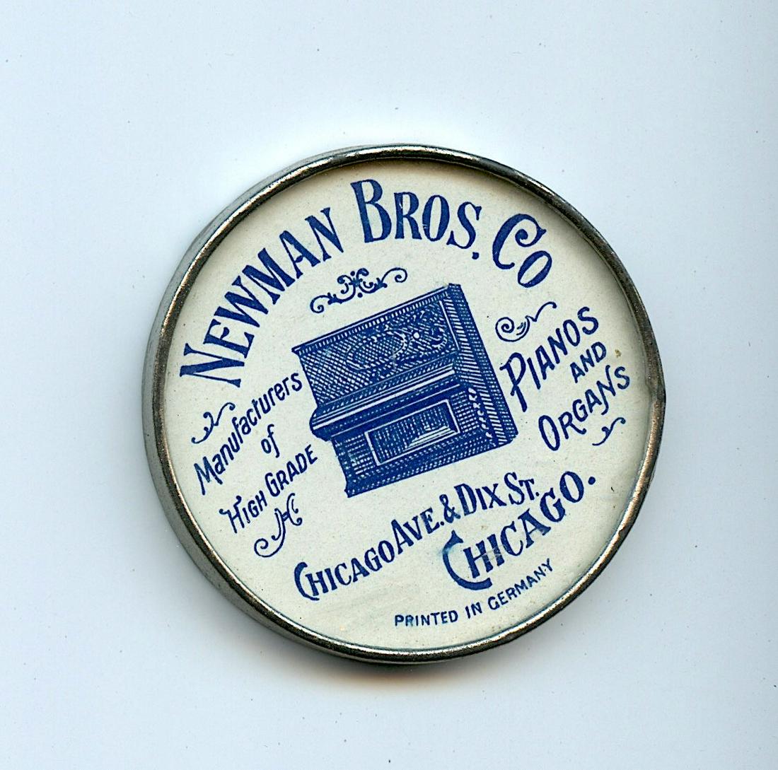 Newman Bros. Co Pianos and Organs, German Pocket: Newman Bros. Co Pianos and Organs. Diameter 2".