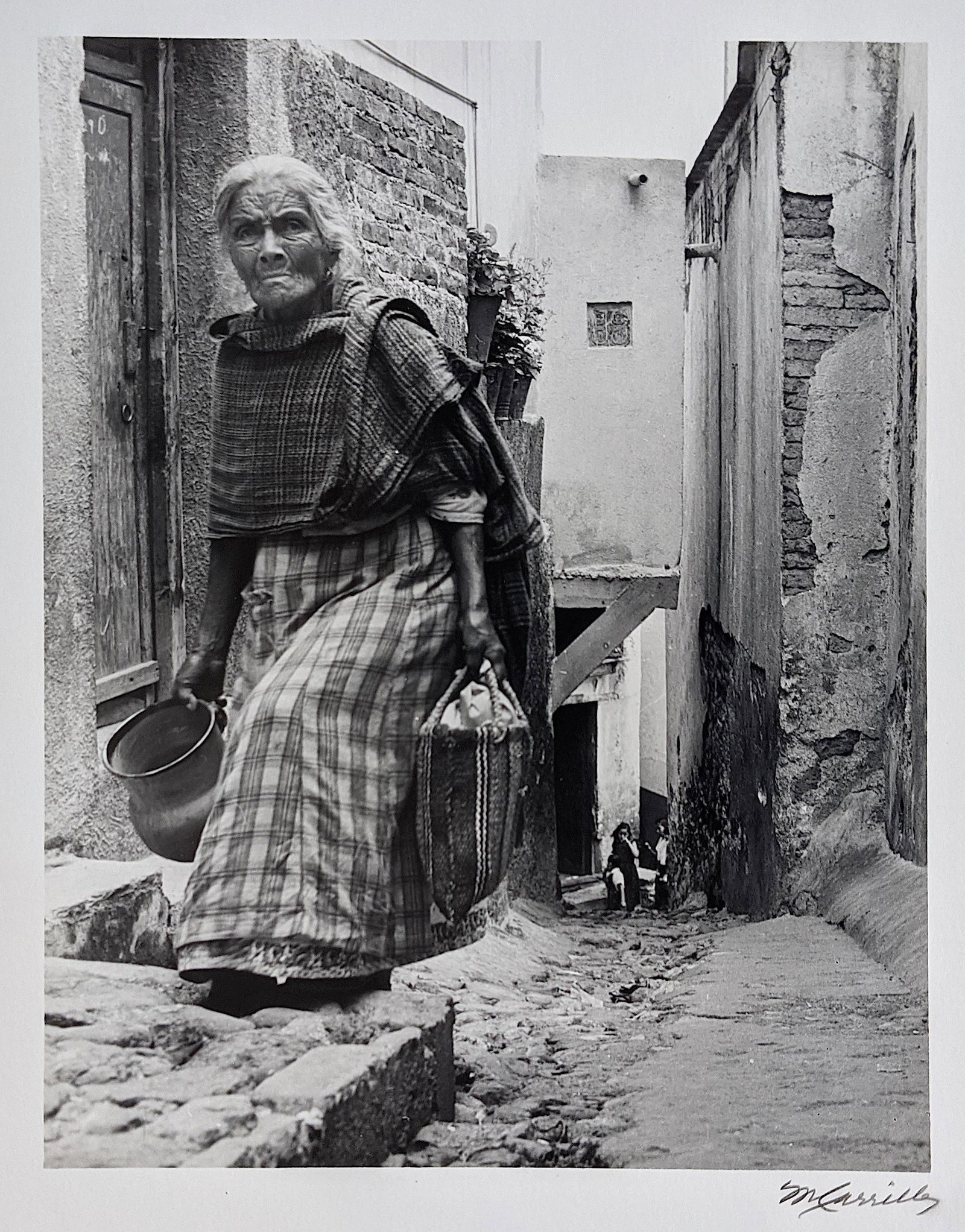 Photo By MANUEL CARRILLO Mexican, 1906-1989 Sign And: Manuel Carrillo began making photographs in 1955 at the age of 49, devoting himself to documenting the indigenous culture of Mexico through informal portraits and depictions of everyday activities. In