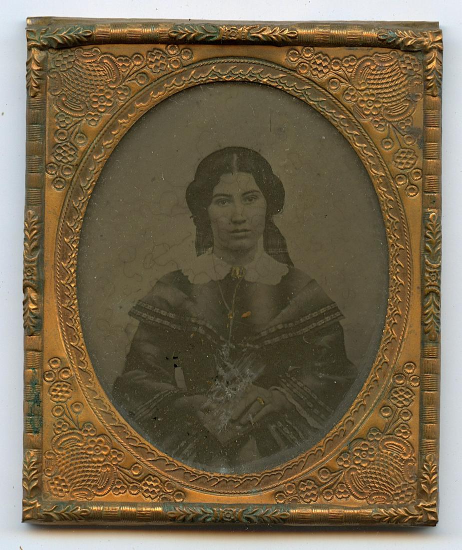 Civil War Era Photo Portrait From Deceased Collector: Antique ambrotype woman with book photo. Provenance from a deceased collector in Maryland. The dimensions are Approx. 3.5" x 2.75" (closed case) This lot is located in Boca Raton, Fl and its shipment 