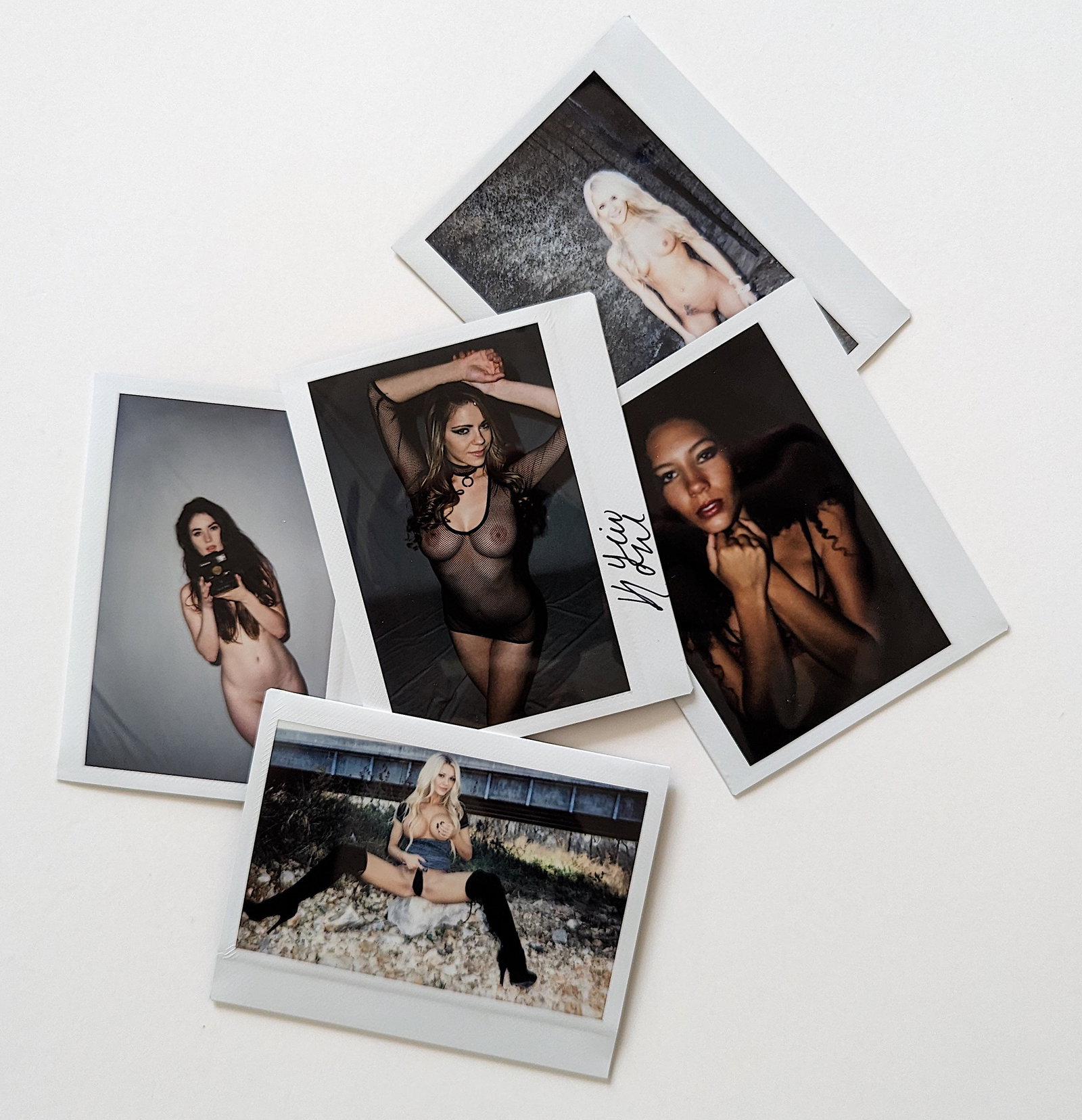 Set 5 Original Polaroid / Intax Photos Pin Up Nudes: Provenance from a Professional American photographer and collector during the last 30 years in LA, CA.. Each Polaroid / Intax film photo measures Aprox. 4.25" x 3.5". This lot is located in Boca Raton