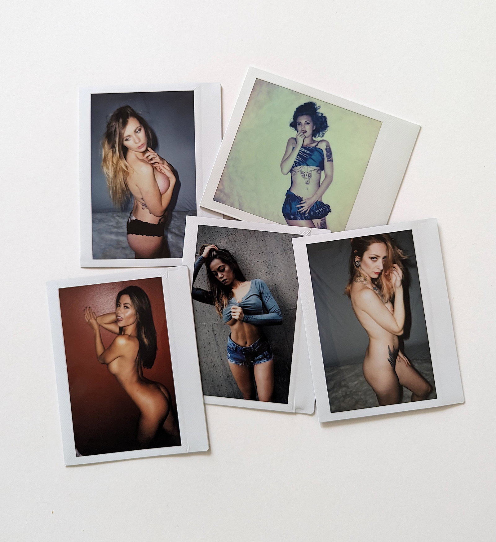 Set 5 Original Polaroid / Intax Photos Pin Up Nudes: Provenance from a Professional American photographer and collector during the last 30 years in LA, CA.. Each Polaroid / Intax film photo measures Aprox. 4.25" x 3.5". This lot is located in Boca Raton