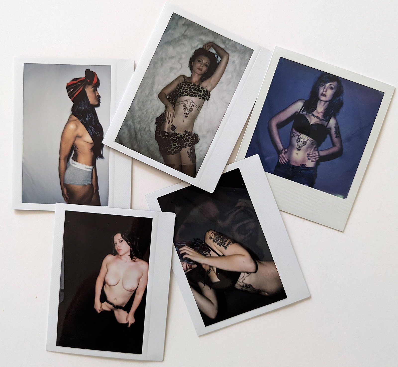 Set 5 Original Polaroid / Intax Photos Pin Up Nudes: Provenance from a Professional American photographer and collector during the last 30 years in LA, CA.. Each Polaroid / Intax film photo measures Aprox. 4.25" x 3.5". This lot is located in Boca Raton