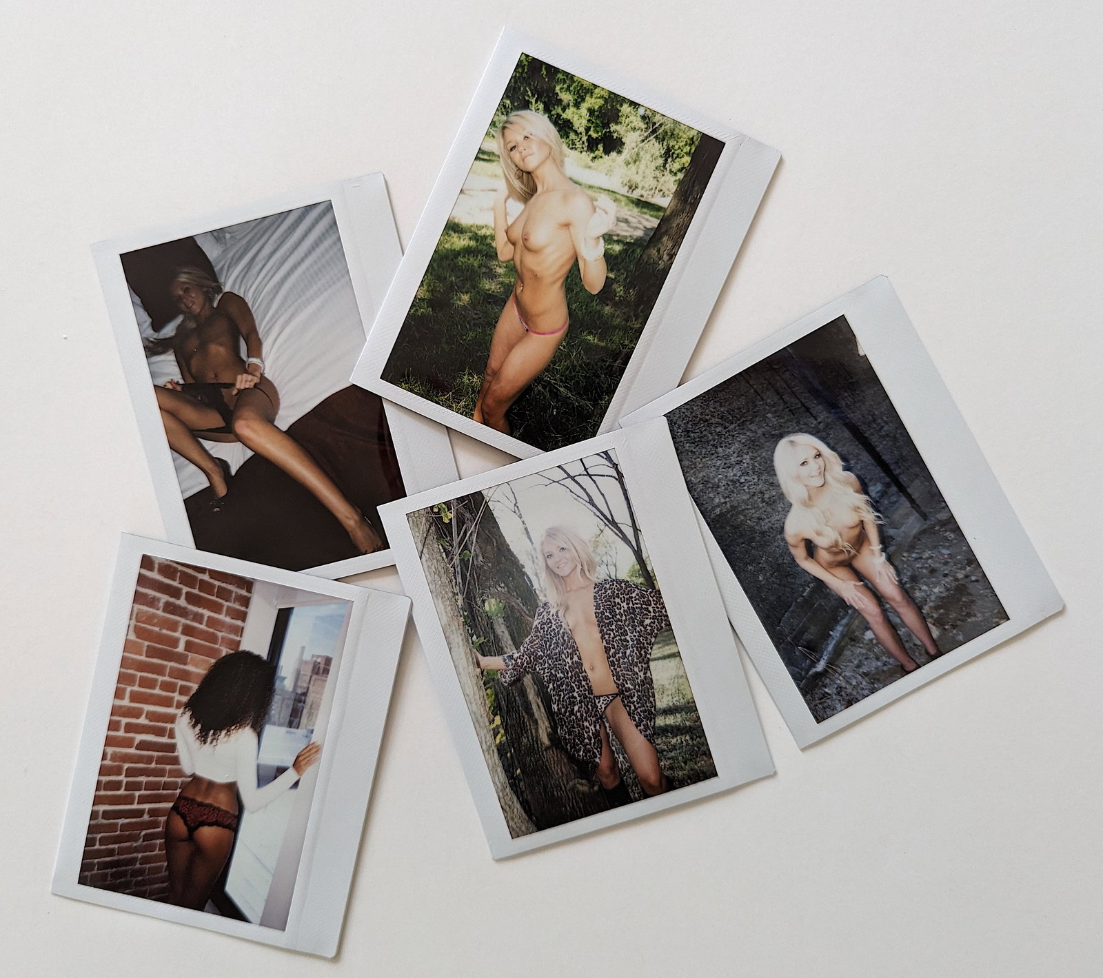 Set 5 Original Polaroid / Intax Photos Pin Up Nudes: Provenance from a Professional American photographer and collector during the last 30 years in LA, CA.. Each Polaroid / Intax film photo measures Aprox. 4.25" x 3.5". This lot is located in Boca Raton
