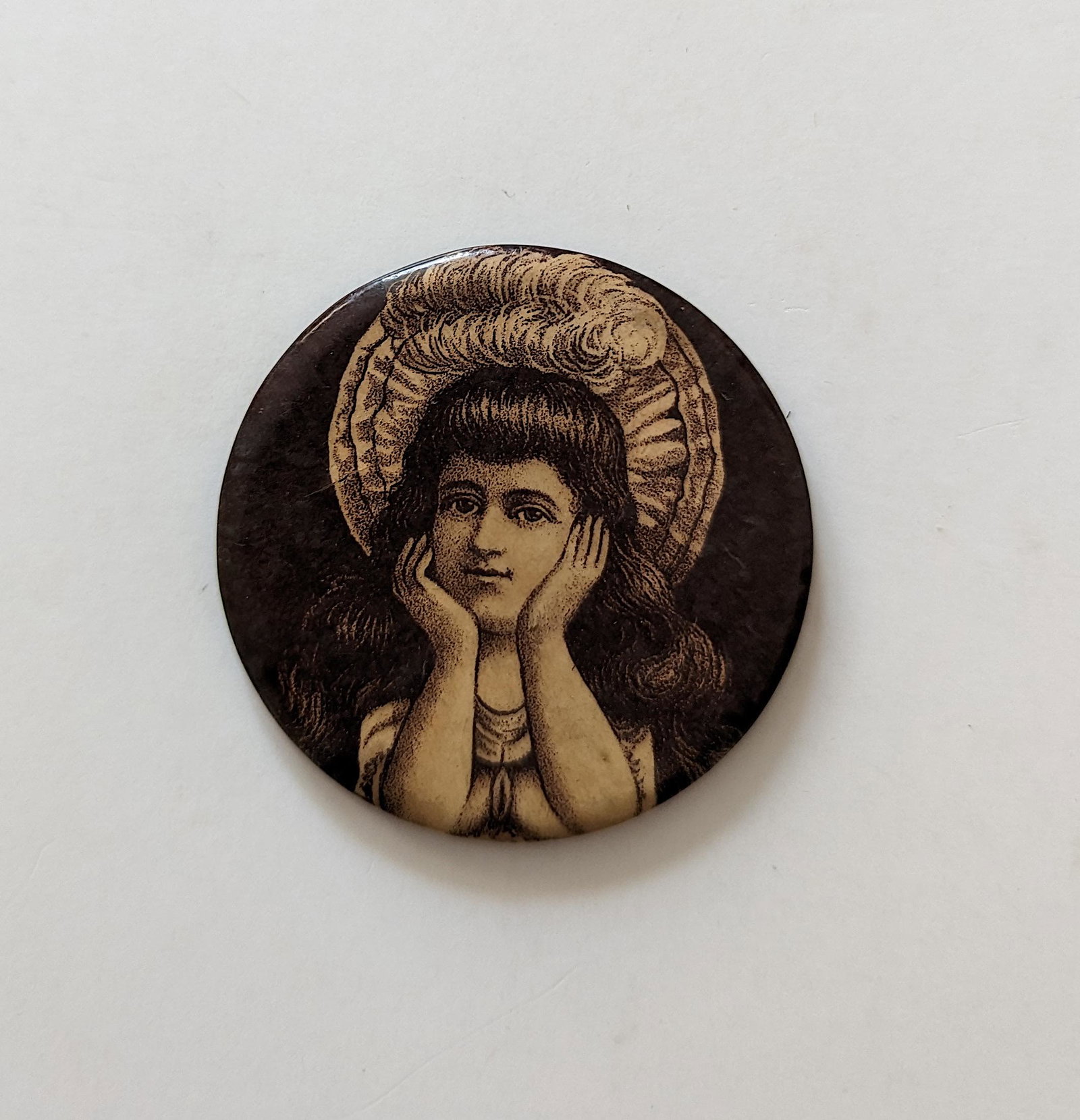 Risque Erotic Pocket Mirror of Woman with Hat Saloon, Ca. 1900s: A circa 1900 Risque Erotic Pocket Mirror of a pretty Woman wearing a Hat. When held upside down her arms look like leads and is somewhat suggestive. It was probably given away at a saloon or Bordello.