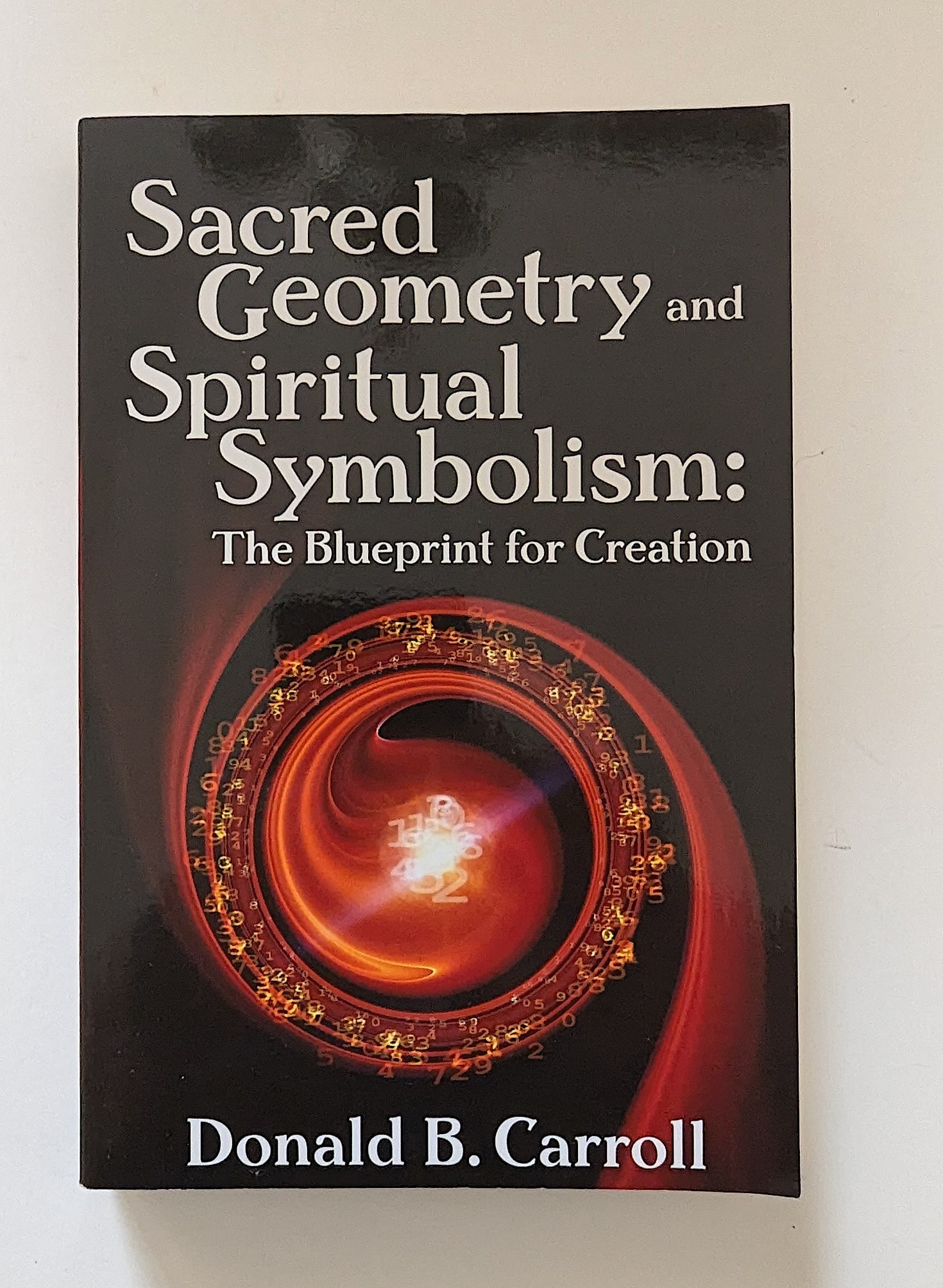 Scarce Used Book Sacred Geometry and Spiritual Symbolism: Book by Donald B. Carroll. Provenance from the estate of a WWII veteran collector in GA.. We have included quality scans to show it's actual condition. This lot is located in Boca Raton, Fl and its sh