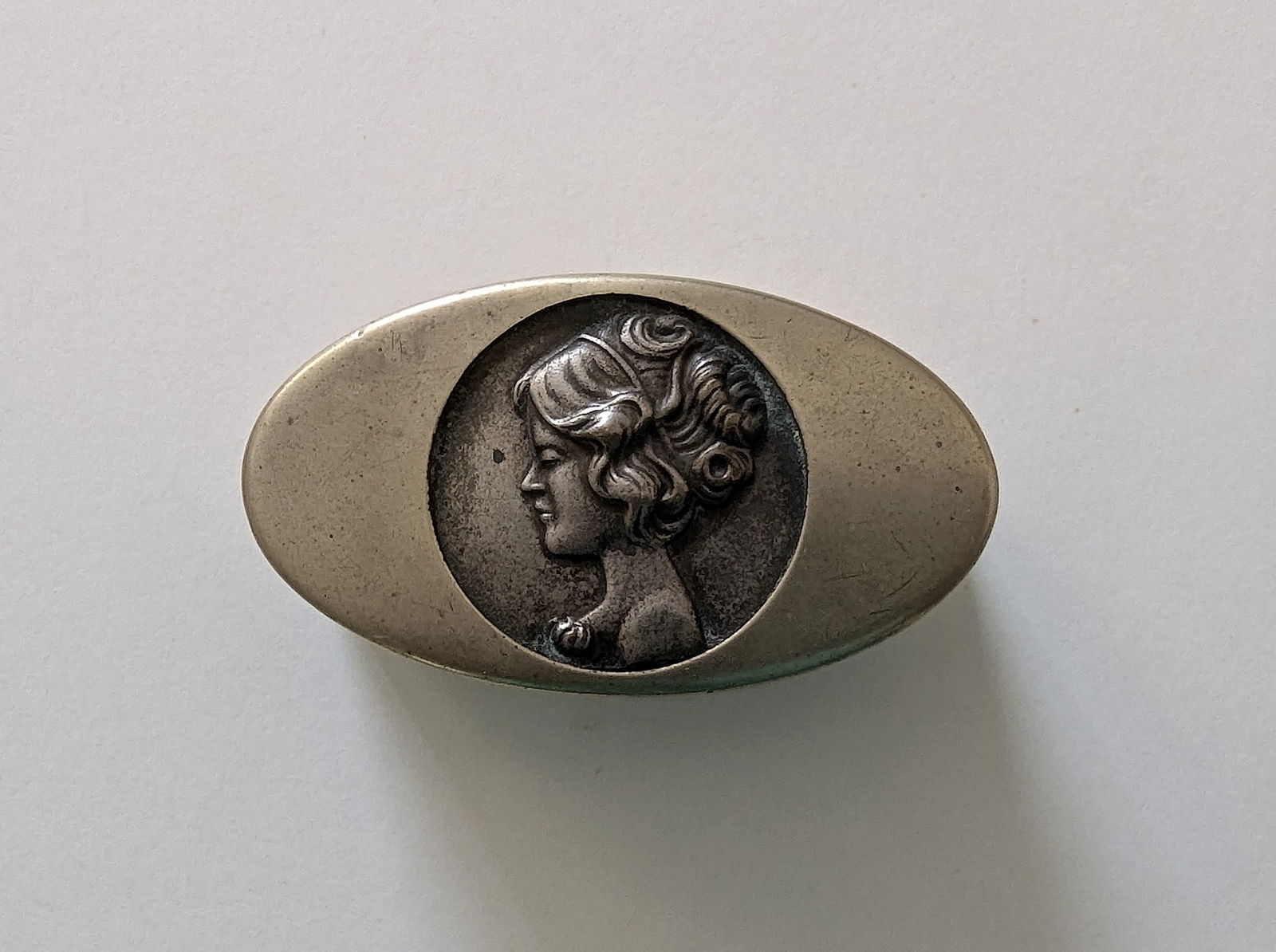 Vintage English Sterling Nouveau Pill Box Lady: Plated Nickel Silver Box. The dimensions are Approx. 2.75"x 1.5" x 1" (small variances can occur). Provenance from a PBC Collector. We have included quality scans to show it's actual condition. This l