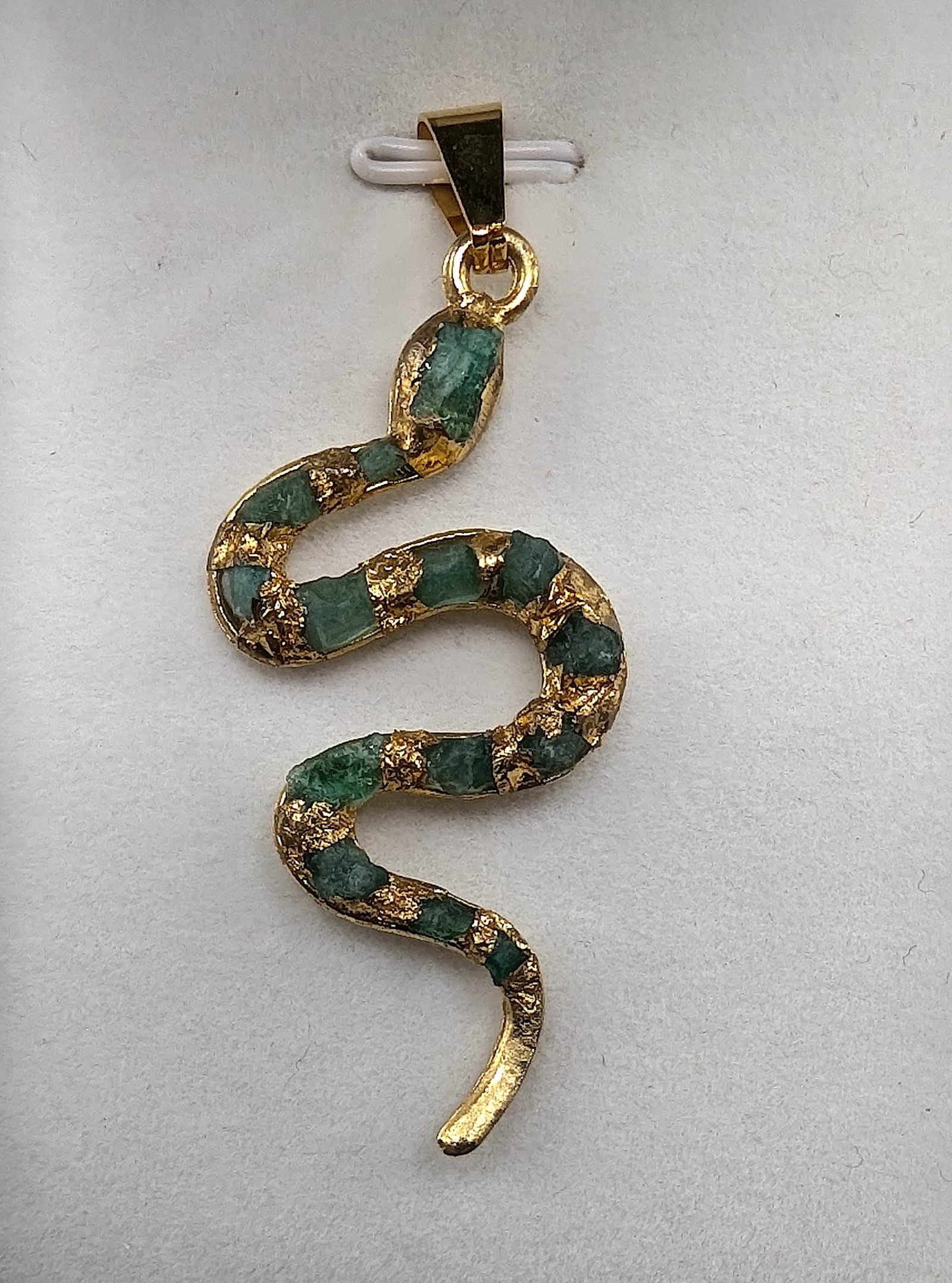 Genuine Pendant Colombian Emerald Morralla Gold Filled Snake: Original uncut raw emerald murralla directly from the mines in Boyaca, Colombia South America. Designed and hand carfted by Colombian artist Monica Oliveros Reyes. The Approx dimensions are 58.90mm Lo