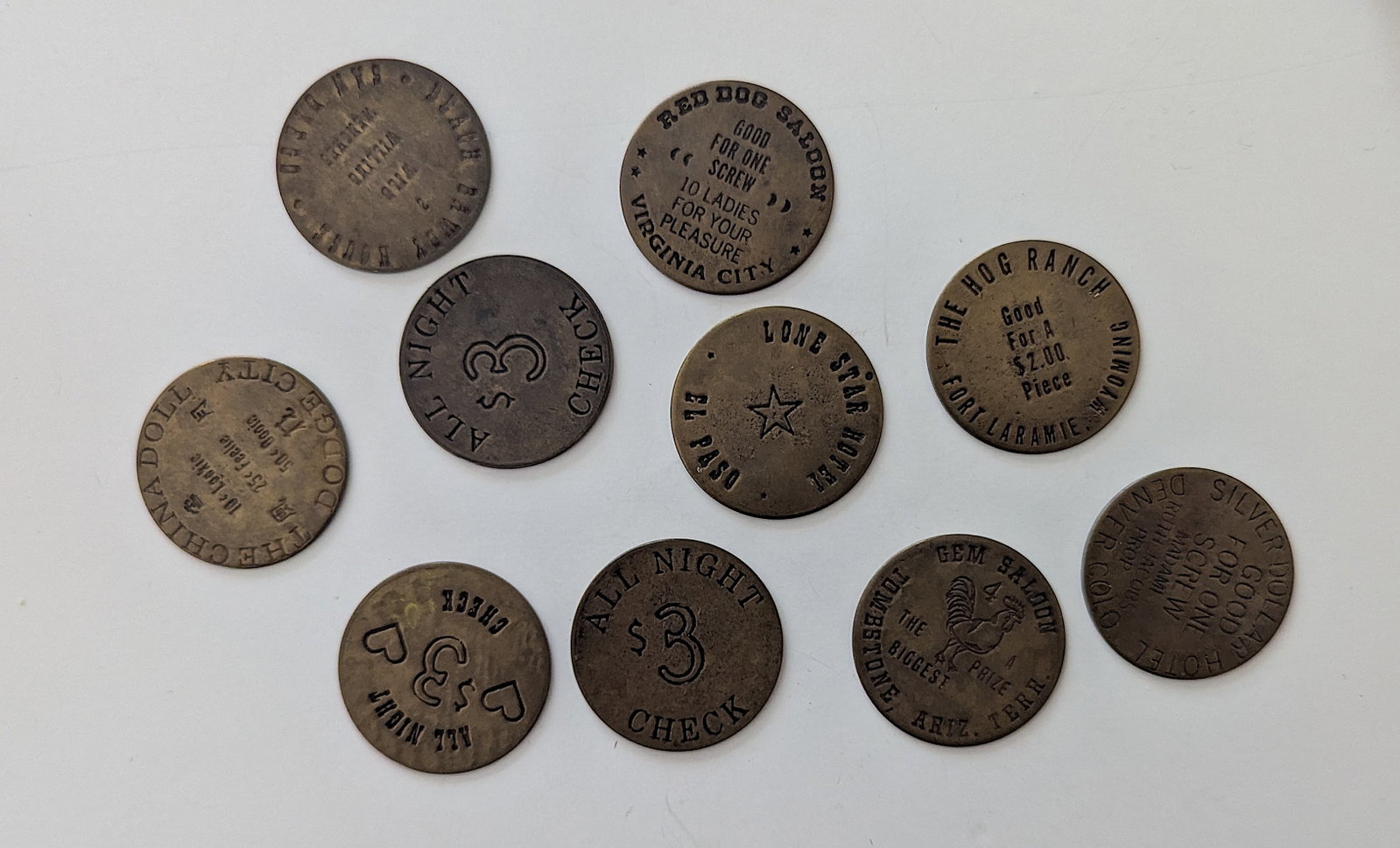 Vintage Lot of 10 Western Saloon Brothel Brass Tokens: The provenance of this lot is from a quality collector PBC. Please see all the included images to read all related information. We have included quality scans to show it's actual condition. This lot i