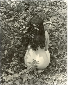 Unknown photographer Back view of a woman in the forest, 1950