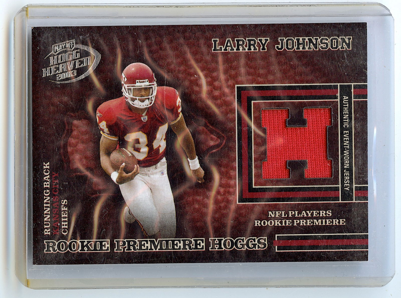 2003 LARRY JOHNSON Piece of Jersey Playoff #207 703/750 Football: The provenance of this lot is from a quality collector in LA, California. We have included a quality scan to show it's actual condition.. This lot is located in Boca Raton, Fl and its shipment will be