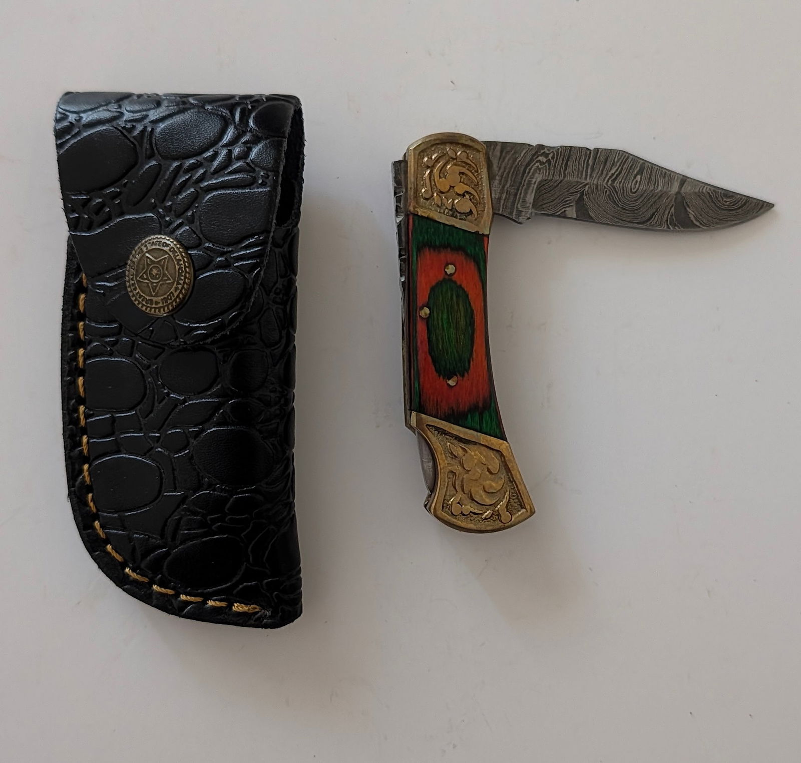 Handcrafted Heirloom Damascus Steel Knife with Leather Sheath OPP!: These aren't your average factory-made knives. Each handmade damascus knife is a unique work of art, forged with time-honored techniques and the skill of a dedicated craftsperson. The distinctive laye