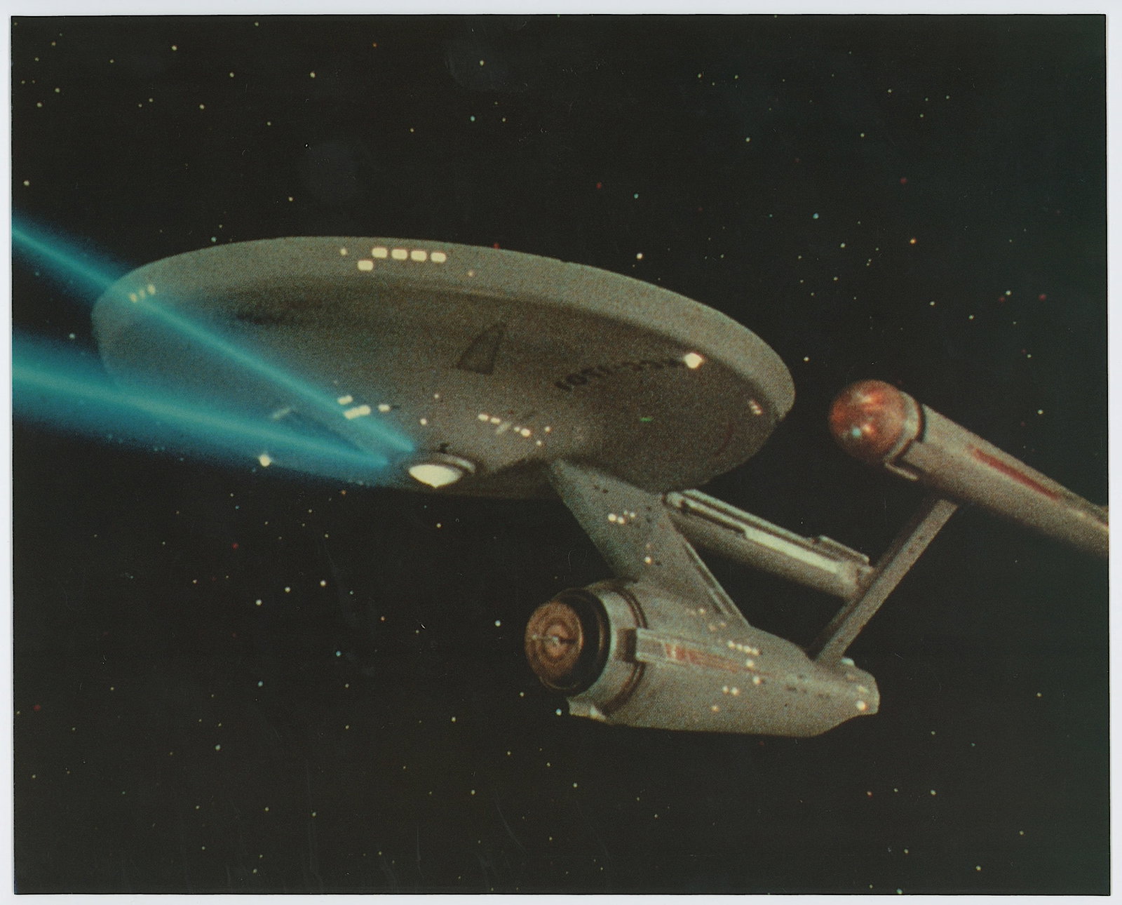 Vintage Movie Color Litho USS Enterprise (NCC-1701): The provenance of this lot is from the a private collector in RI. We have included quality images to show it's actual condition. The dimensions are Approx. 10" x 8". This lot is located in Boca Raton,