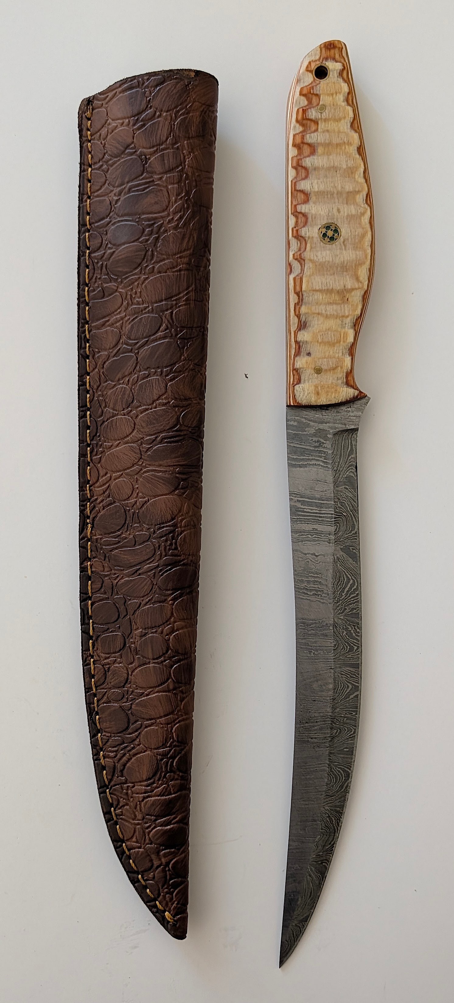Handcrafted Heirloom Damascus Steel Knife with Leather Sheath OPP!: These aren't your average factory-made knives. Each handmade damascus knife is a unique work of art, forged with time-honored techniques and the skill of a dedicated craftsperson. The distinctive laye