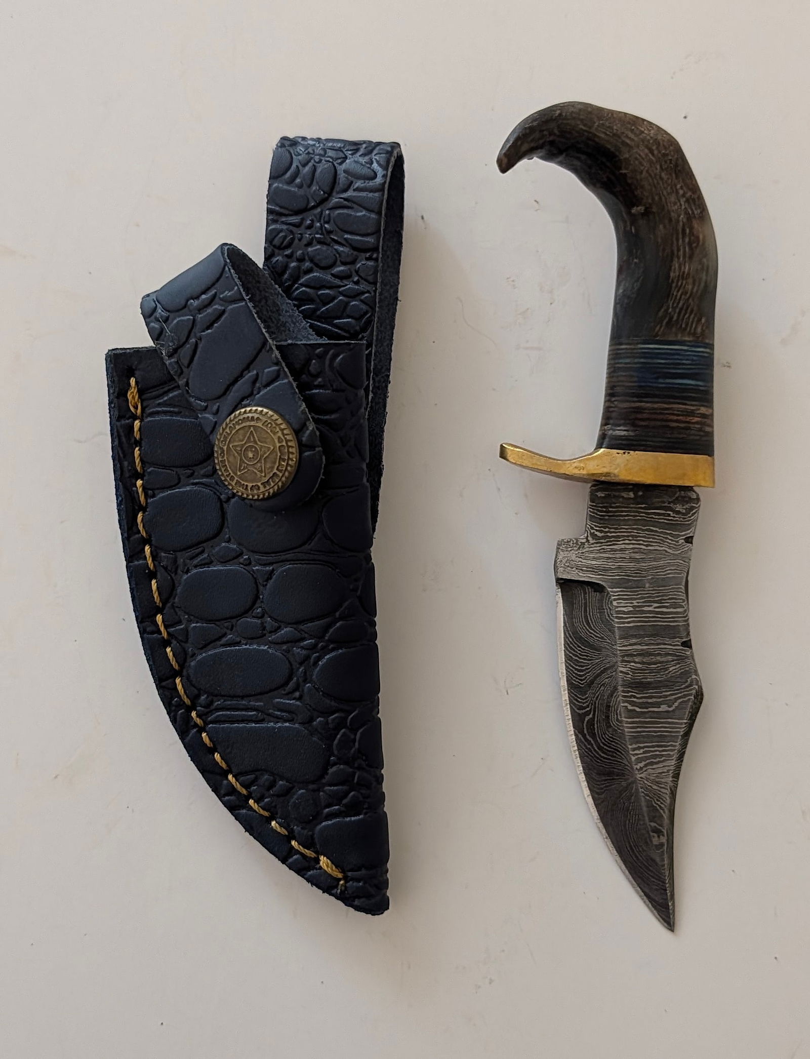 Handcrafted Heirloom Damascus Steel Knife with Leather Sheath OPP!: These aren't your average factory-made knives. Each handmade damascus knife is a unique work of art, forged with time-honored techniques and the skill of a dedicated craftsperson. The distinctive laye