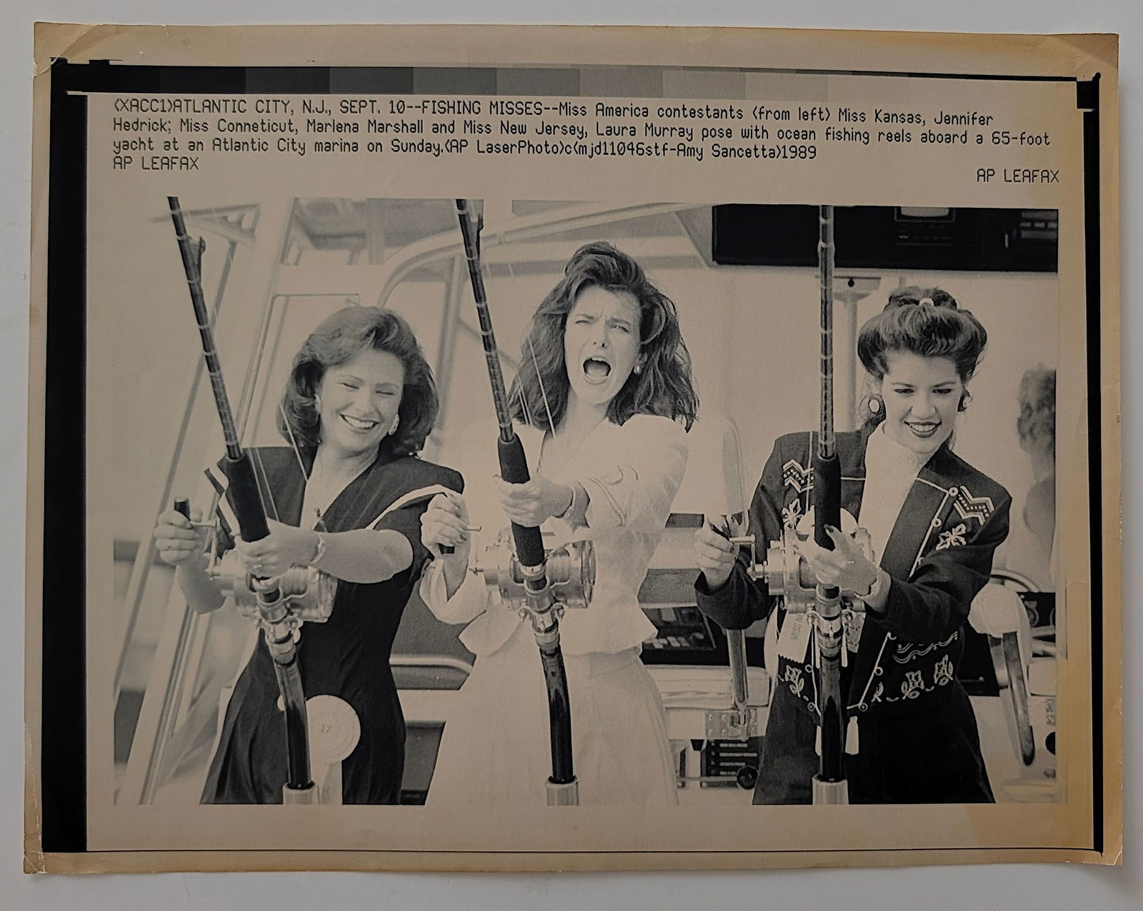 Press Fax Miss America Constestants Fishing Reels, 1989: This lot is coming from the estate of a collector in RI. We have included a quality scan to show it's actual condition.The dimensions are Approx. 8.5" x 11". This lot is located in Boca Raton, Fl and