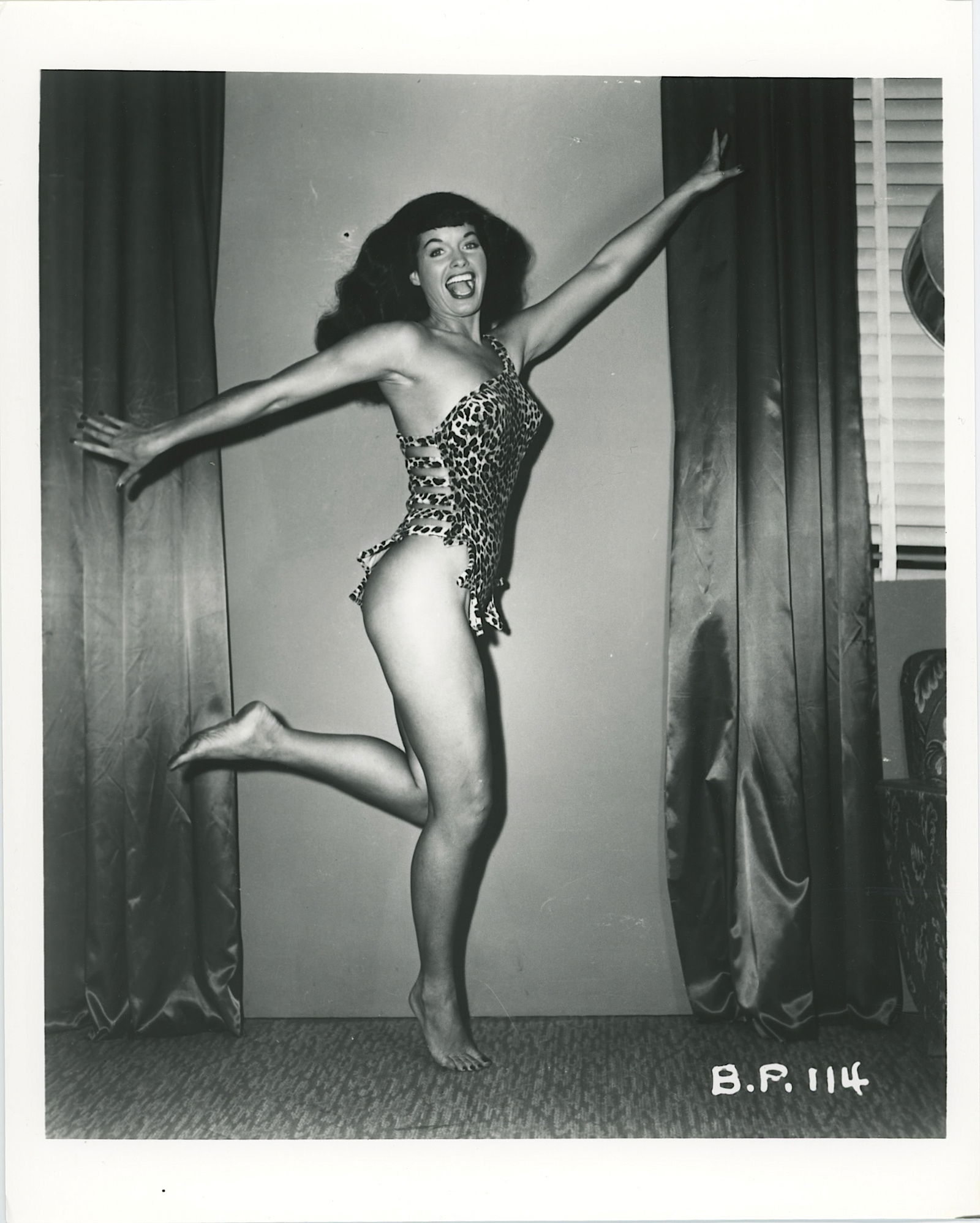 Vintage Photograph Pin-Up Model BETTIE PAGE by Irving Klaw: This lot is coming from the estate of a collector in RI. We have included a quality scan to show it's actual condition. The dimensions are Approx. 10" x 8". This lot is located in Boca Raton, Fl and i