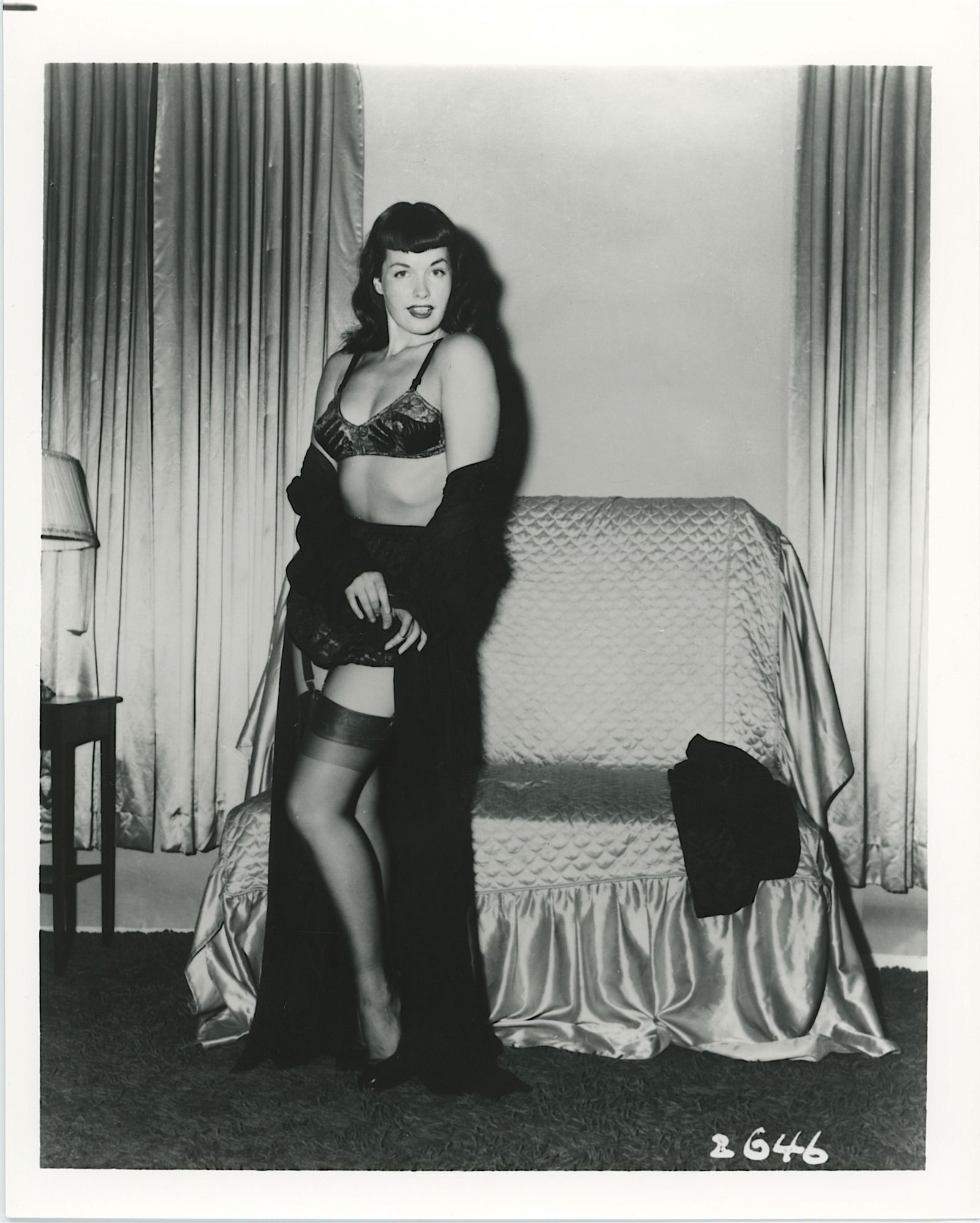Vintage Photograph Pin-Up Model BETTIE PAGE by Irving Klaw: This lot is coming from the estate of a collector in RI. We have included a quality scan to show it's actual condition. The dimensions are Approx. 10" x 8". This lot is located in Boca Raton, Fl and i