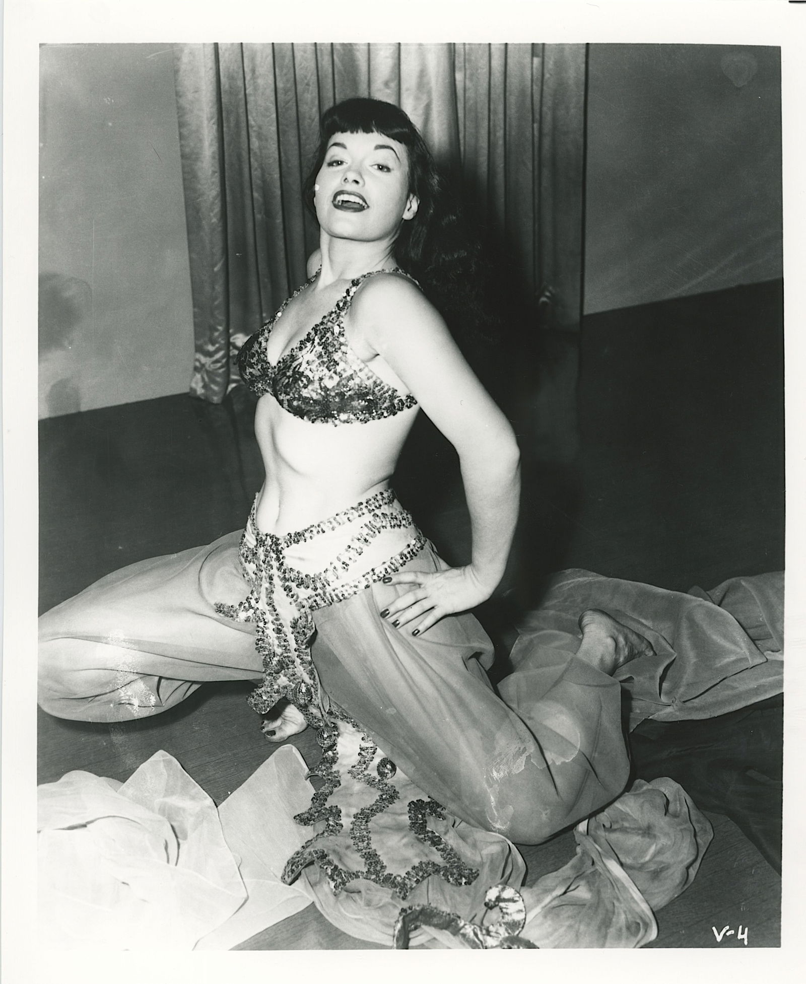 Vintage Photograph Pin-Up Model BETTIE PAGE by Irving Klaw: This lot is coming from the estate of a collector in RI. We have included a quality scan to show it's actual condition. The dimensions are Approx. 10" x 8". This lot is located in Boca Raton, Fl and i