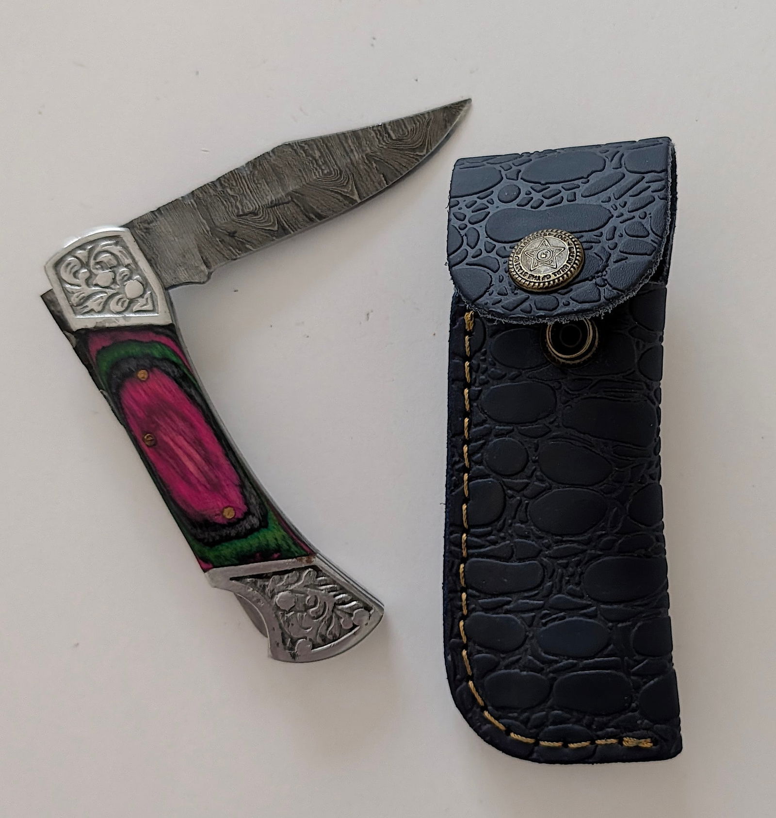 Handcrafted Heirloom Damascus Steel Knife with Leather Sheath OPP!: These aren't your average factory-made knives. Each handmade damascus knife is a unique work of art, forged with time-honored techniques and the skill of a dedicated craftsperson. The distinctive laye