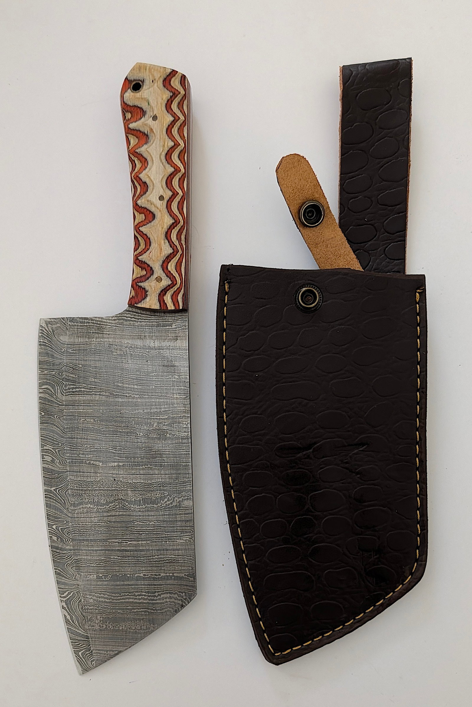Handcrafted Heirloom Damascus Steel Knife with Leather Sheath OPP!: These aren't your average factory-made knives. Each handmade damascus knife is a unique work of art, forged with time-honored techniques and the skill of a dedicated craftsperson. The distinctive laye