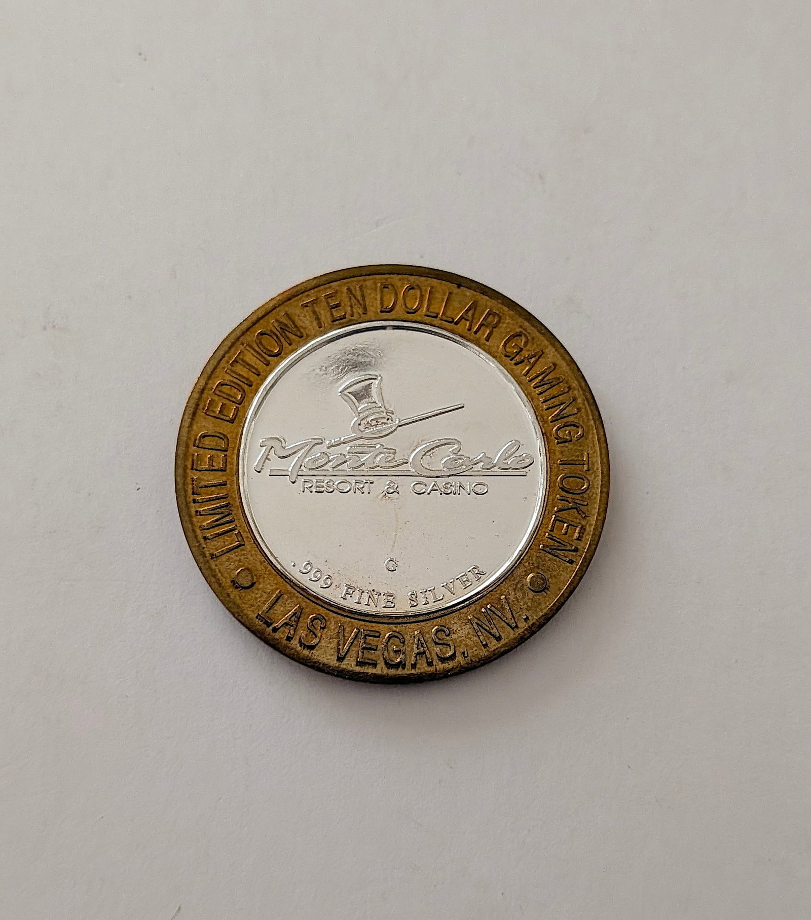 Monte Carlo Resort & Casino Ltd. Ed. $10 Gaming Silver Token: It is a collectible "Silver Strike" token, which were popular in Las Vegas casinos. The center is made of .999 fine silver. It has approximately 0.6 troy oz .999 Silver and the vintage design can be r